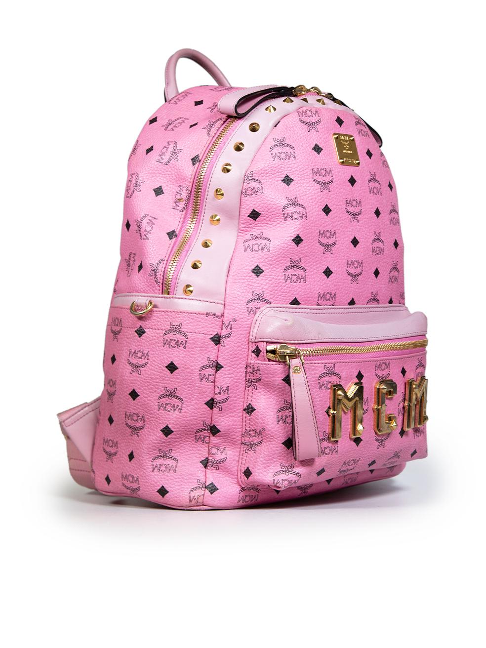 CONDITION is Good. General wear to the backpack is evident. There are abrasions on the bottom four base corners of the bag and the corners on the outer zip pocket. The front hardware logo, engraved logo and stud details have some scratches and are