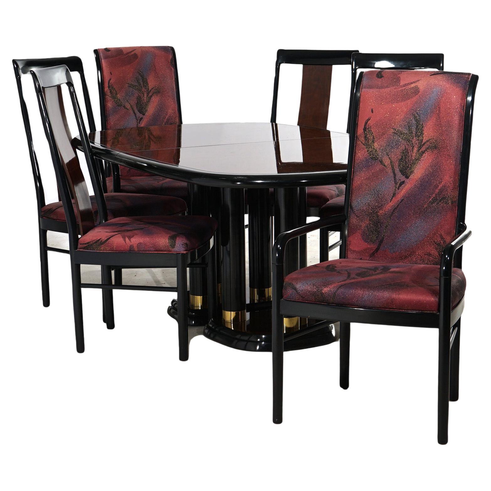 A Mid Century Modern dining set by Drexel of the Profiles line offers extension table with mahogany top, two leaves and ebonized cluster column base having brass bands; ebonized chairs with upholstery; maker label as photographed; 20th