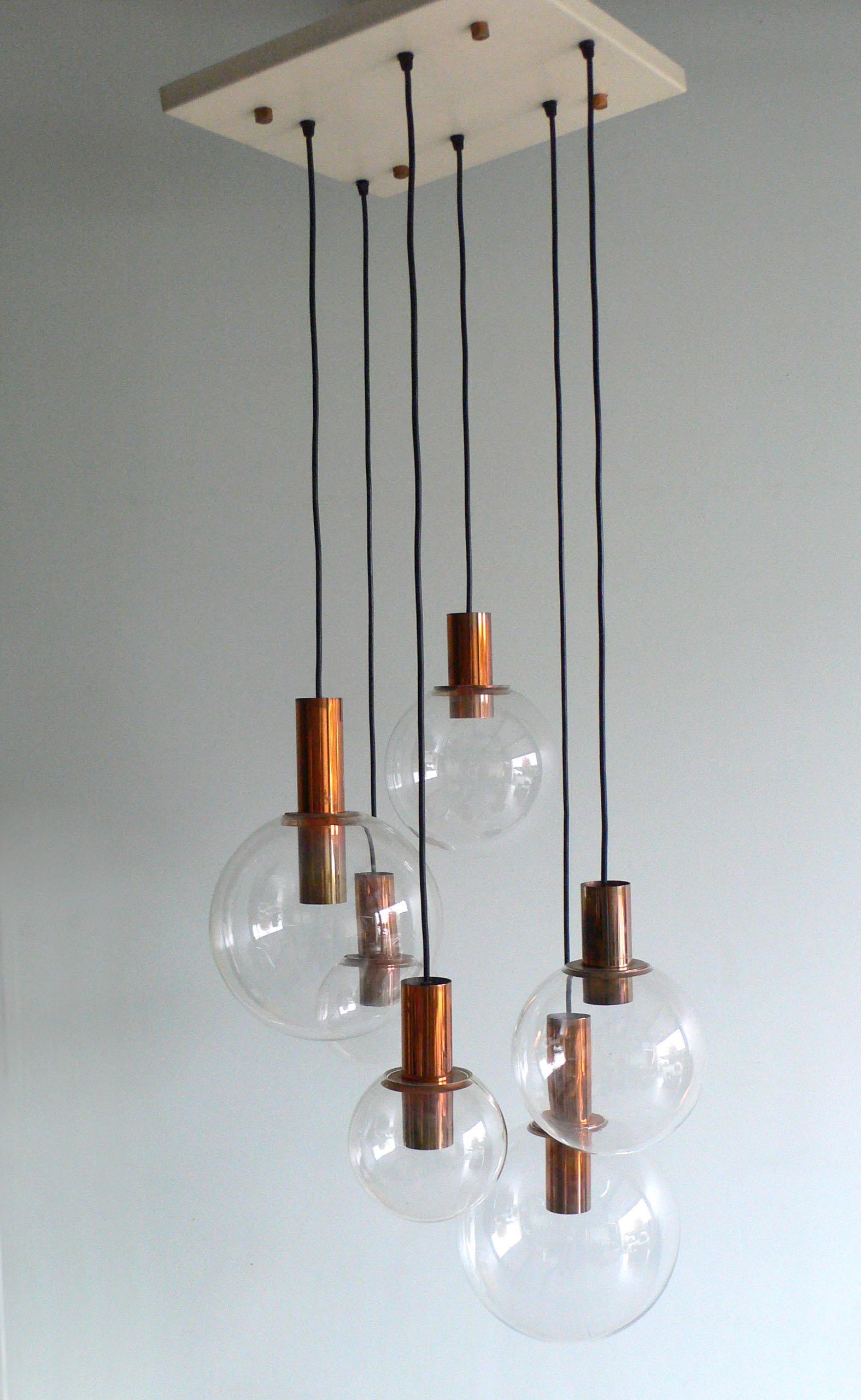 A vintage Mid-Century Modern dutch late 1960's Design Copper & Glass large pendant hanging lamp Chandelier with 6 glass balls. Made in Holland in the late 1960's, early 1970's. Attributed to RAAK, Amsterdam. Constructed with glass balls and all