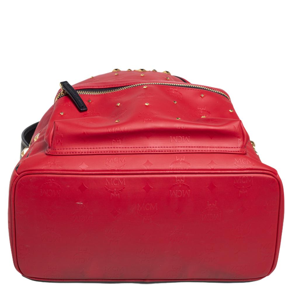 red mcm backpack with studs