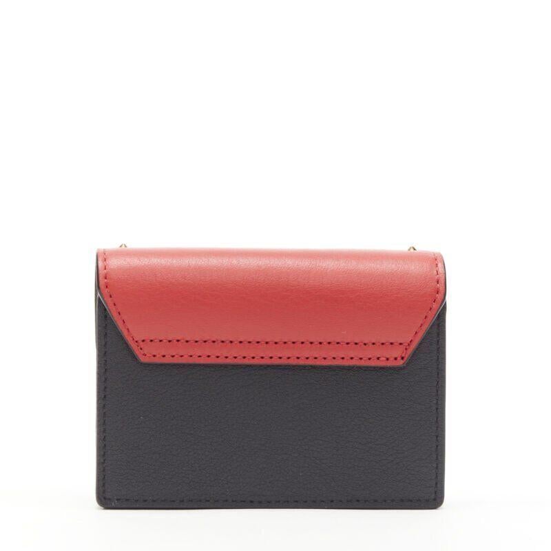 MCM red leopard gold studded flap cardholder micro crossbody chain bag
Reference: CAWG/A00185
Brand: MCM
Material: Leather
Color: Red, Brown
Pattern: Leopard
Closure: Button
Lining:  Leather
Extra Details: Cardholder with crossbody shoulder chain.
