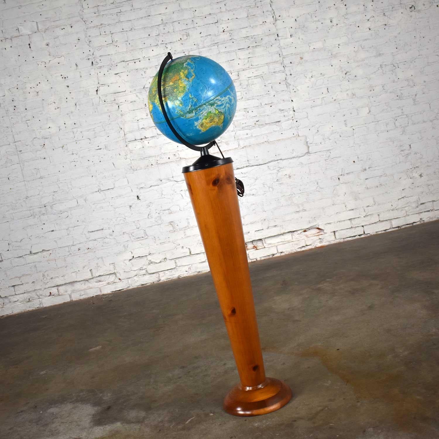 Wonderful Repogle World Horizon Series lighted 12” diameter plastic world globe, metal axle, and a custom pine Stand. Beautiful condition with wear as you would expect with a vintage piece. Please see photos, Circa 1950-1980.

  

See the world