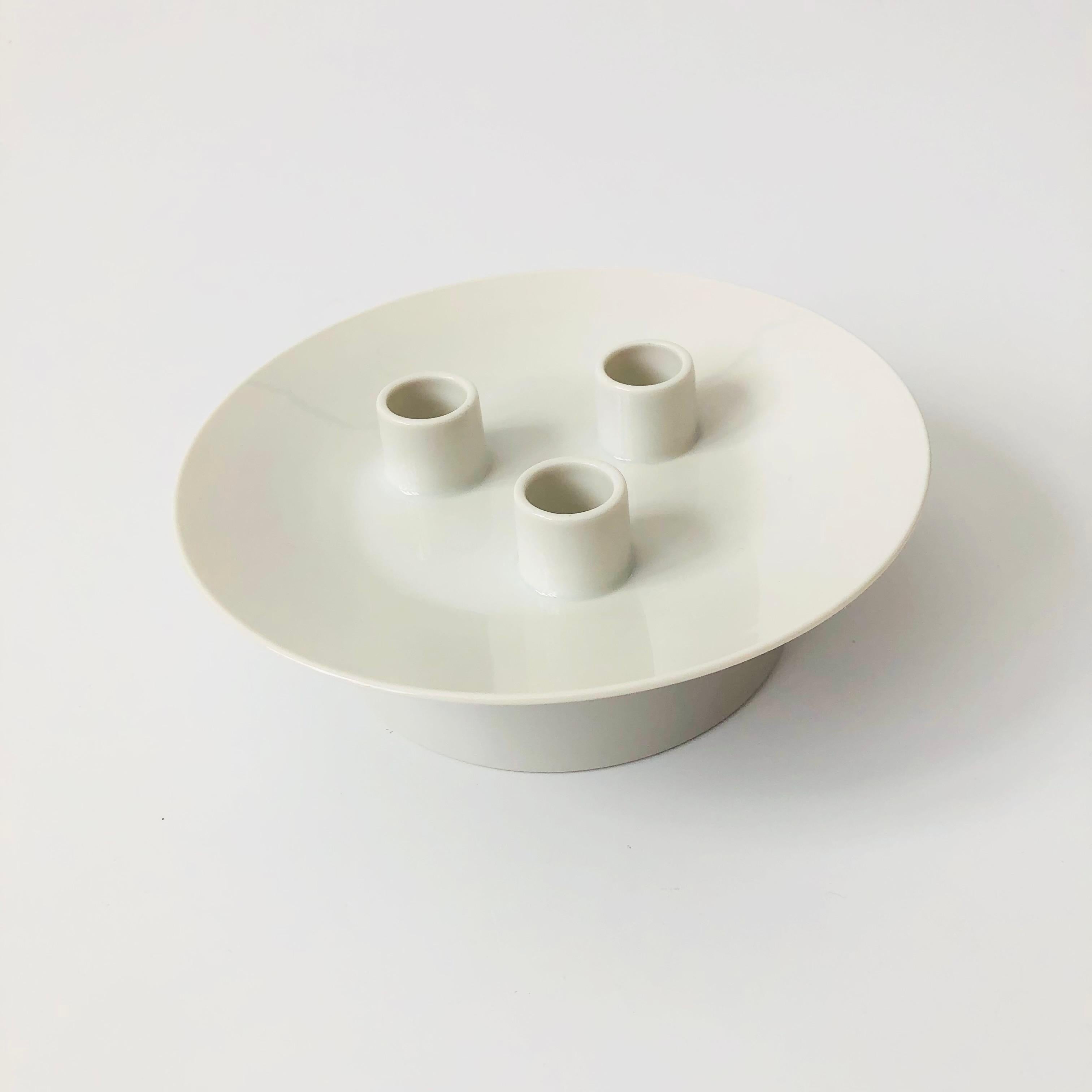 A mid century porcelain triple candle holder from the 