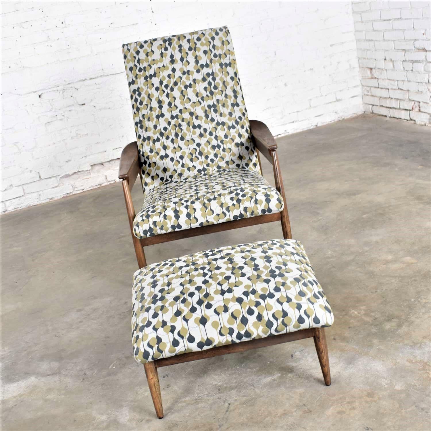 Marvelous MCM (a.k.a. Mid-Century Modern) Scandinavian Style high back lounge chair and ottoman attributed to Home Chair Company. This set has been professionally reupholstered in new fabric with a taupe grey background and black and bronze