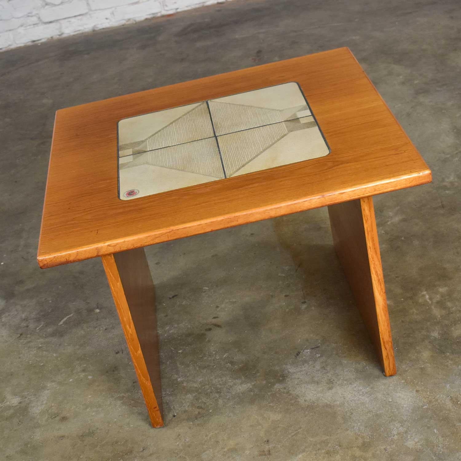 Fabulous Mid-Century Modern Scandinavian teak side table or end table with unique tile insert by Gangso Mobler. Gorgeous vintage condition with no outstanding flaws that we have detected. Please see photos. Circa 1978-1983.

Wow!! Just…. wow!! This