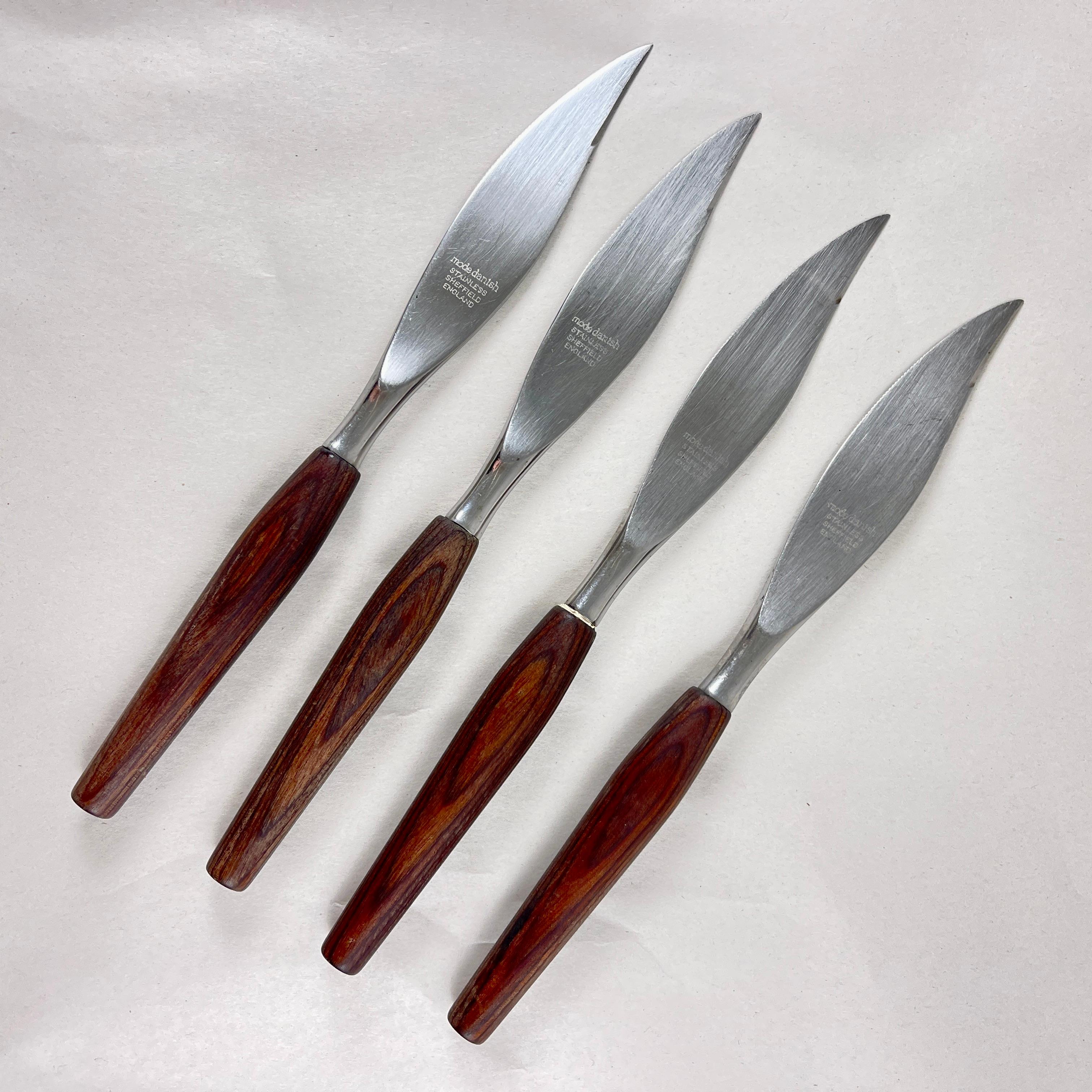 A Mid-Century Modern style set of four Stainless Steel knives made in Sheffield, England, circa 1960s.

From the ‘Mode Danish’ line, beautifully polished Teakwood handles are securely joined to leaf shaped blades.

The blades are partly serrated
