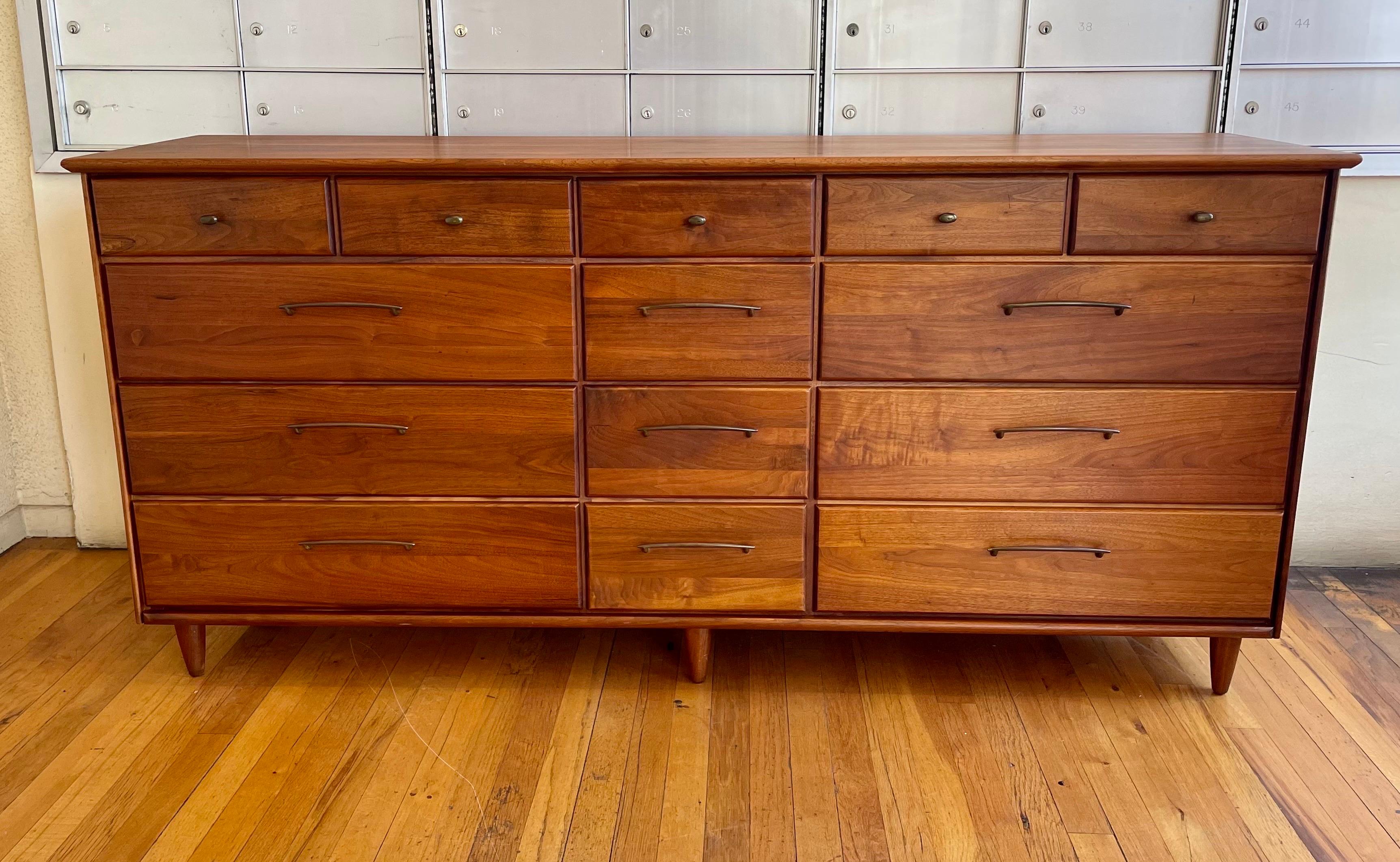 American solid walnut striking high-quality dresser beautiful and unique. California design.

Mid Century Solid Walnut 14 Drawer Dresser by ACE-HI Prelude
Mid-Century Modern · Walnut Furniture · Bedroom Furniture
Measures: 32 1/2