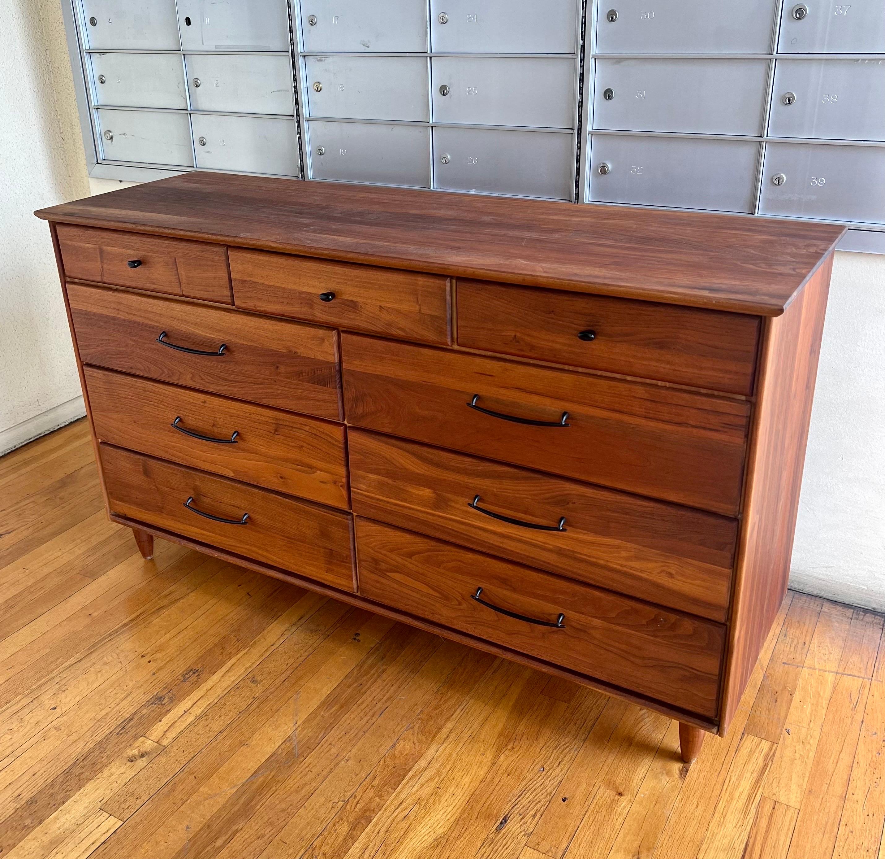 American solid walnut striking high-quality dresser is beautiful and unique. California design freshly refinished in great condition.