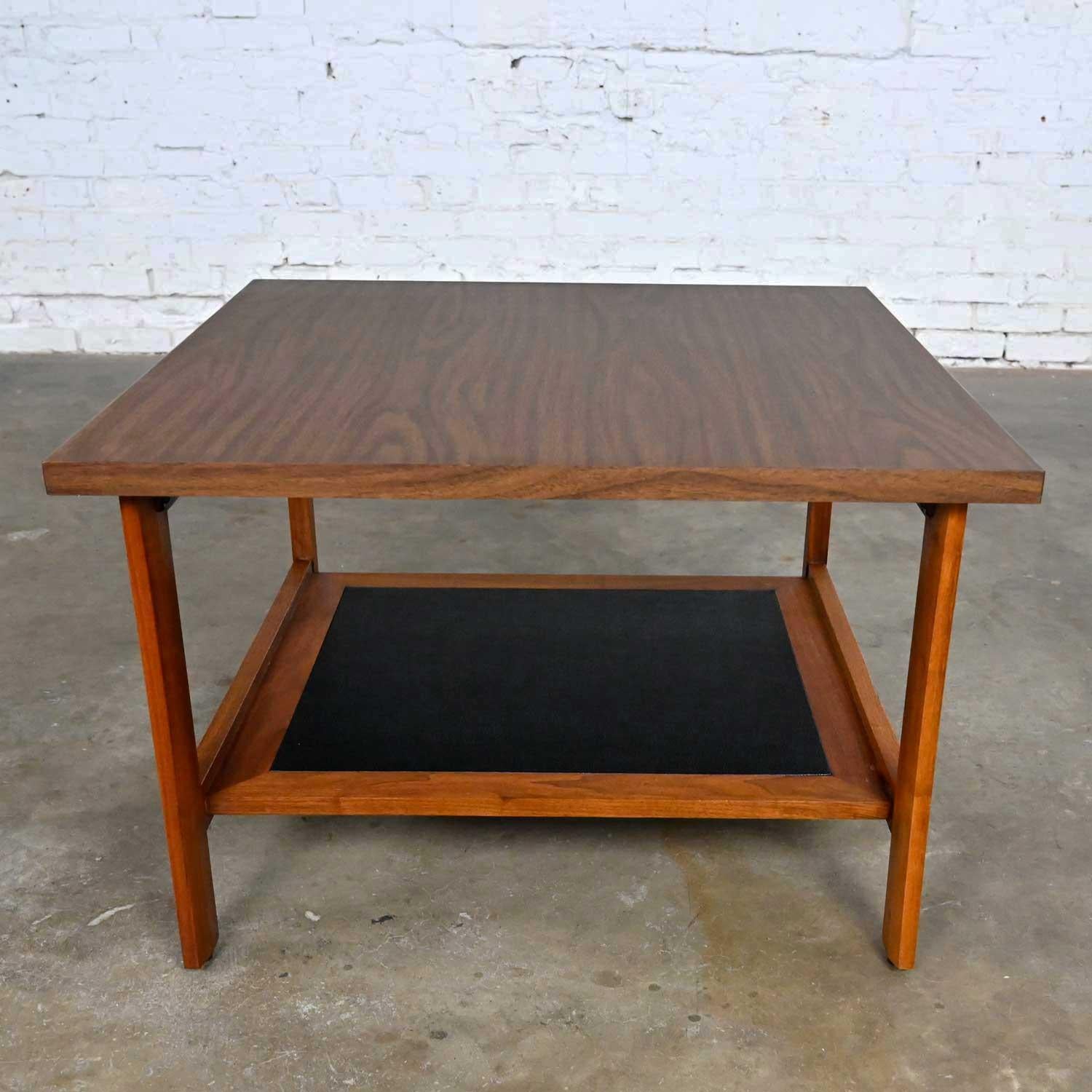 Wonderful Mid-Century Modern square walnut end table lower shelf with a black laminate insert, and laminate top. Beautiful condition, keeping in mind that this is vintage and not new so will have signs of use and wear. Please see photos and zoom in