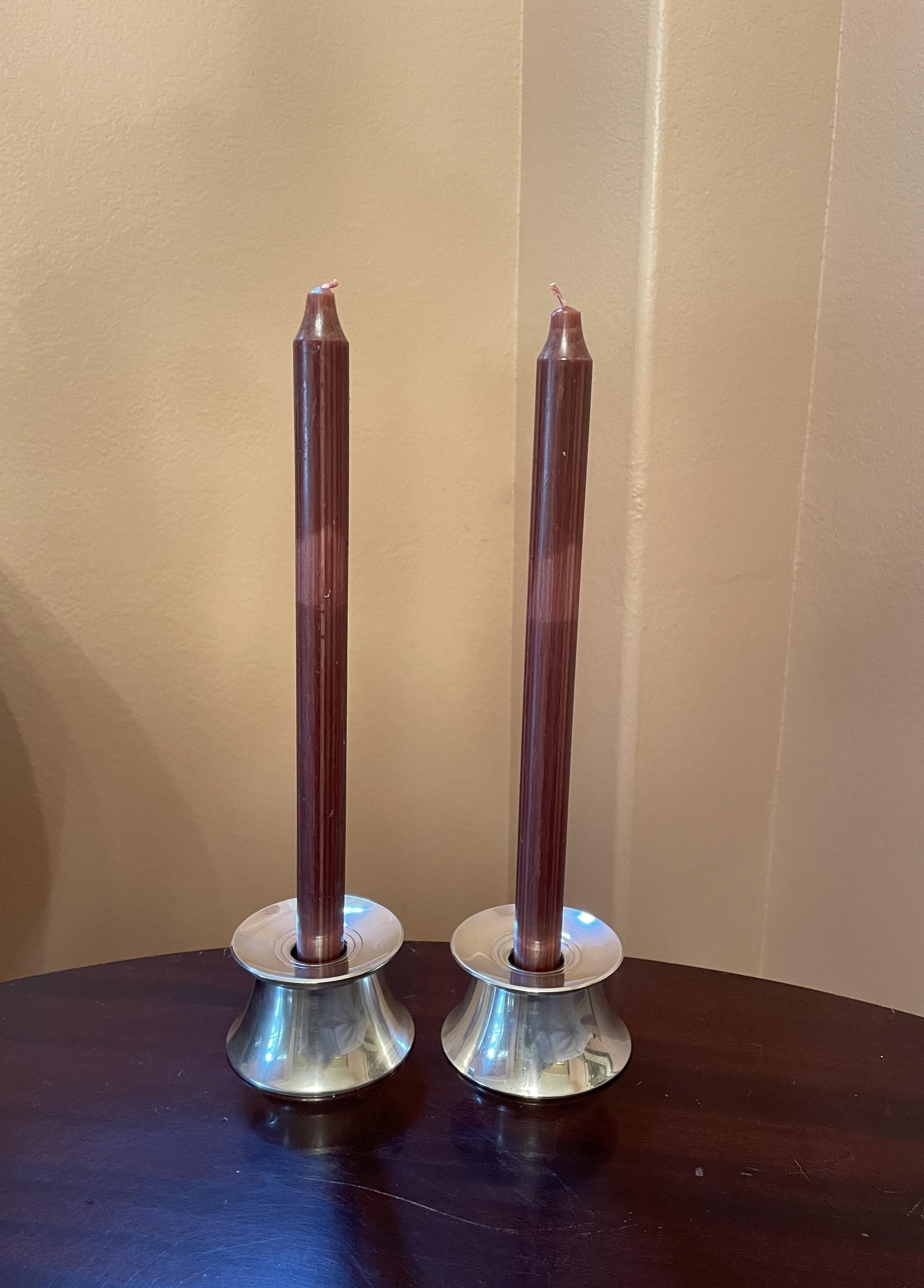 It is difficult to capture in pictures the simple, graceful beauty of this pair of sterling candleholders by Gorham. Classic and timeless MCM! The condition and quality of the silver is excellent, with a soft low-luster patina, and subtle detailing