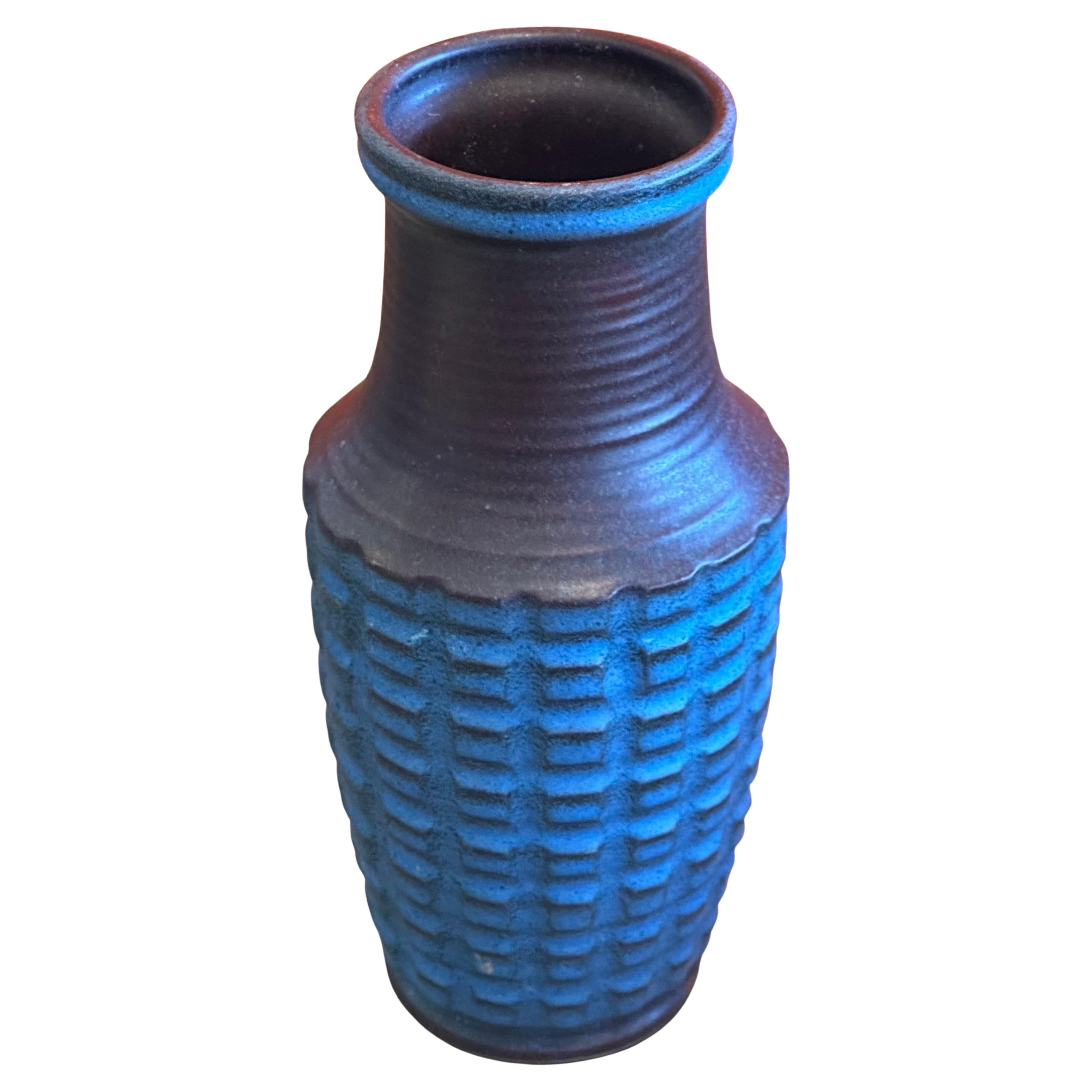 A very nice MCM stoneware vase with a blue grenade like finish by Jasba of Germany, circa 1970s. The vessel is in very good vintage condition with no chips or cracks and measures 4.5