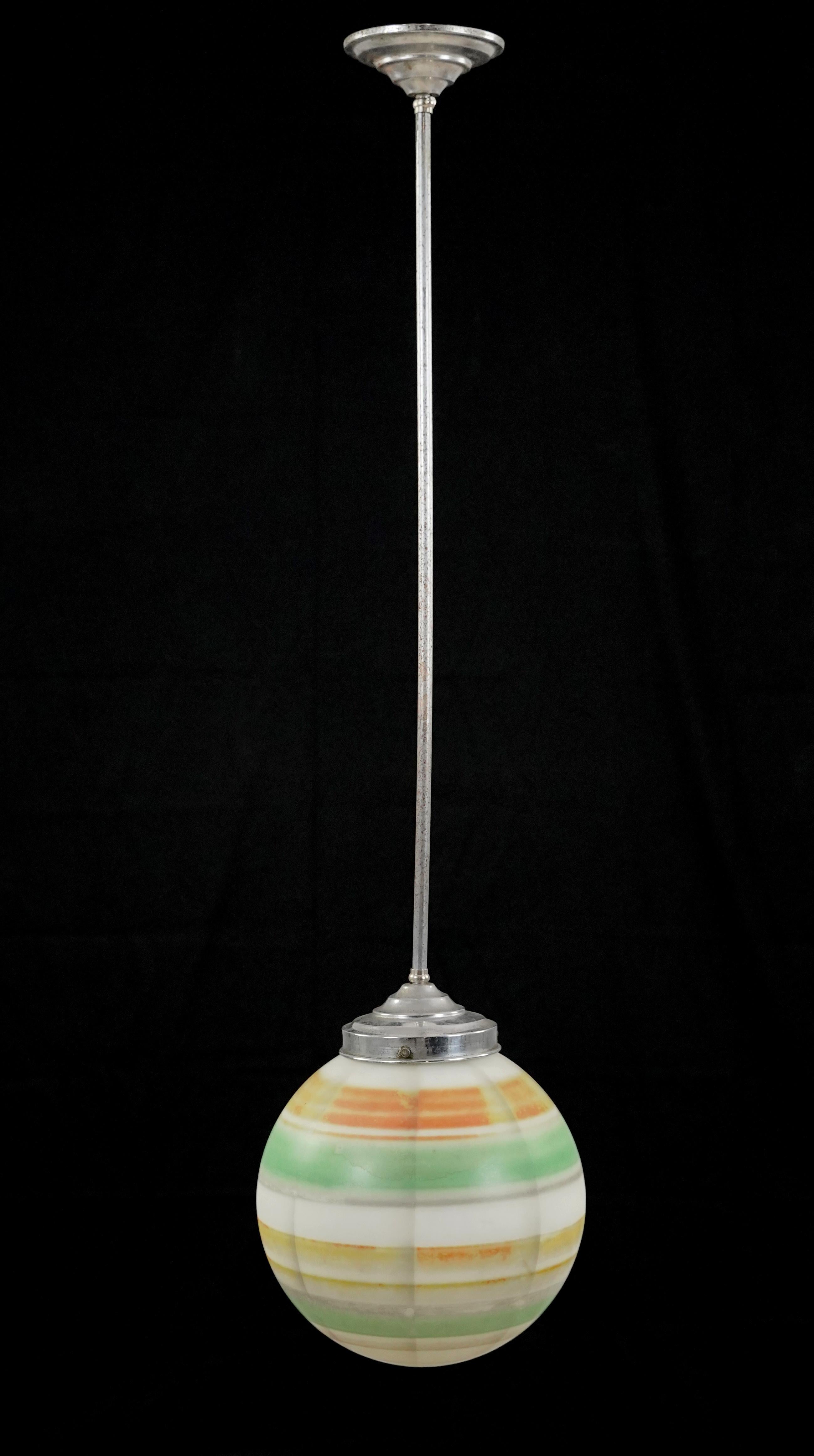 Mid-Century Modern style pendant light with a white, gray, green, orange, and tan striped globe paired with a nickel finish steel pole. This requires one standard Edison style medium base bulb. The price includes restoration of cleaning and