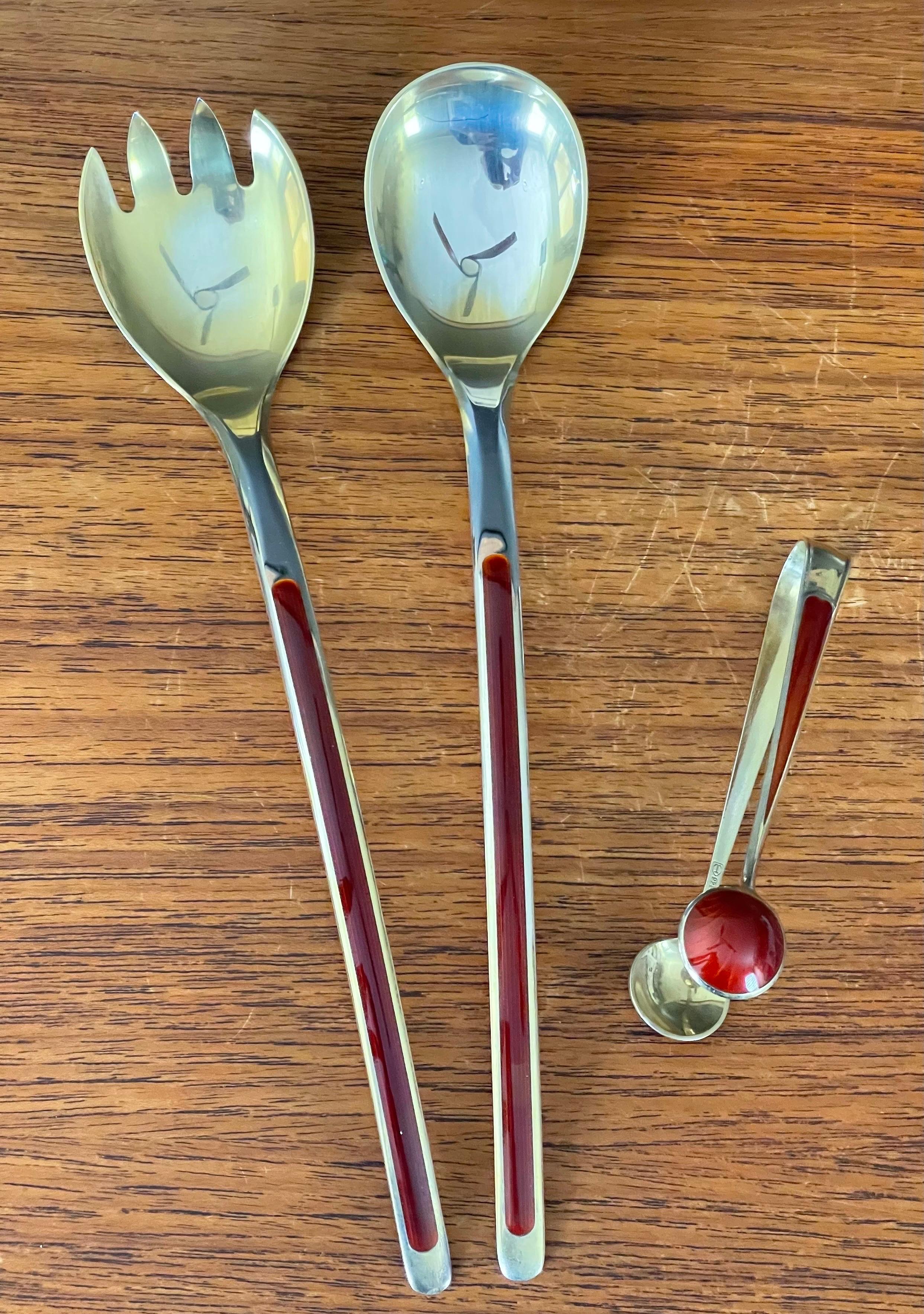 Simple and elegant stylized set of salad servers and tongs made of sterling silver and enamel by Norwegian designer N.M. Thune, circa 1960s. The set is in very good vintage condition and comes in its original box. The servers are 9.75