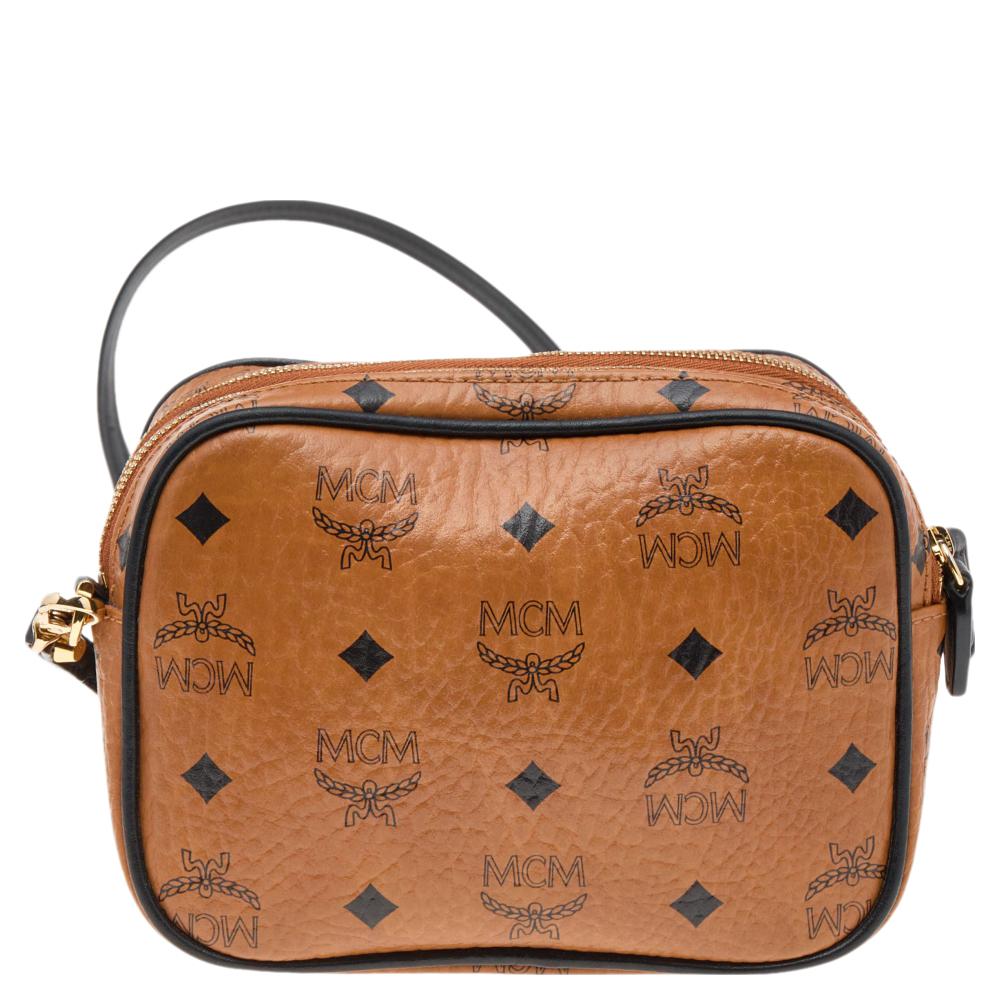 This MCM camera bag is a timeless piece that can last you season after season. This bag is made of Visetos coated canvas as well as leather. It has logo detailing, a long shoulder strap, a fabric-lined interior, and gold-tone hardware.

Includes: