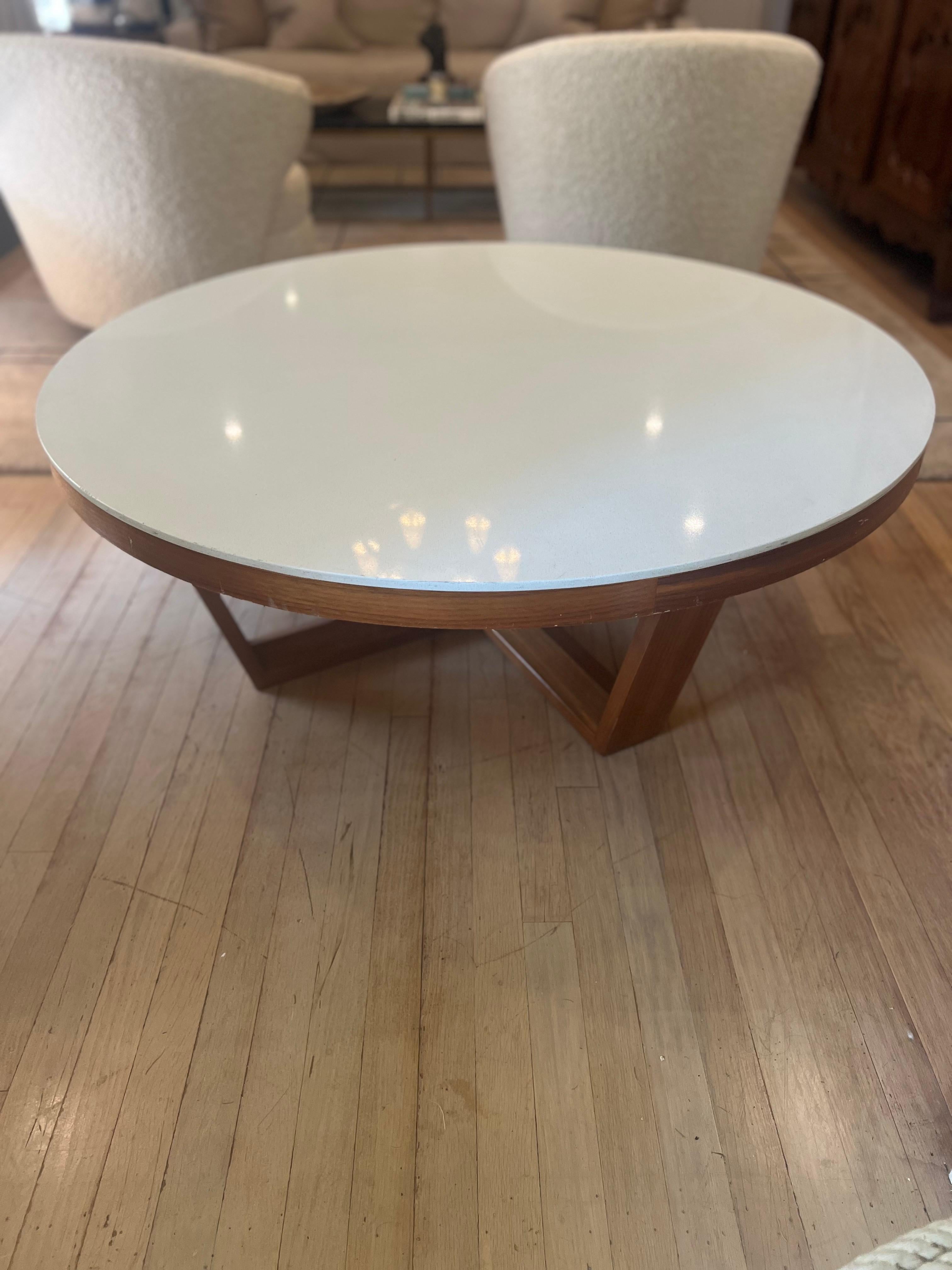 Mid Century Modern cocktail table.   Teak base with cream white stone top.