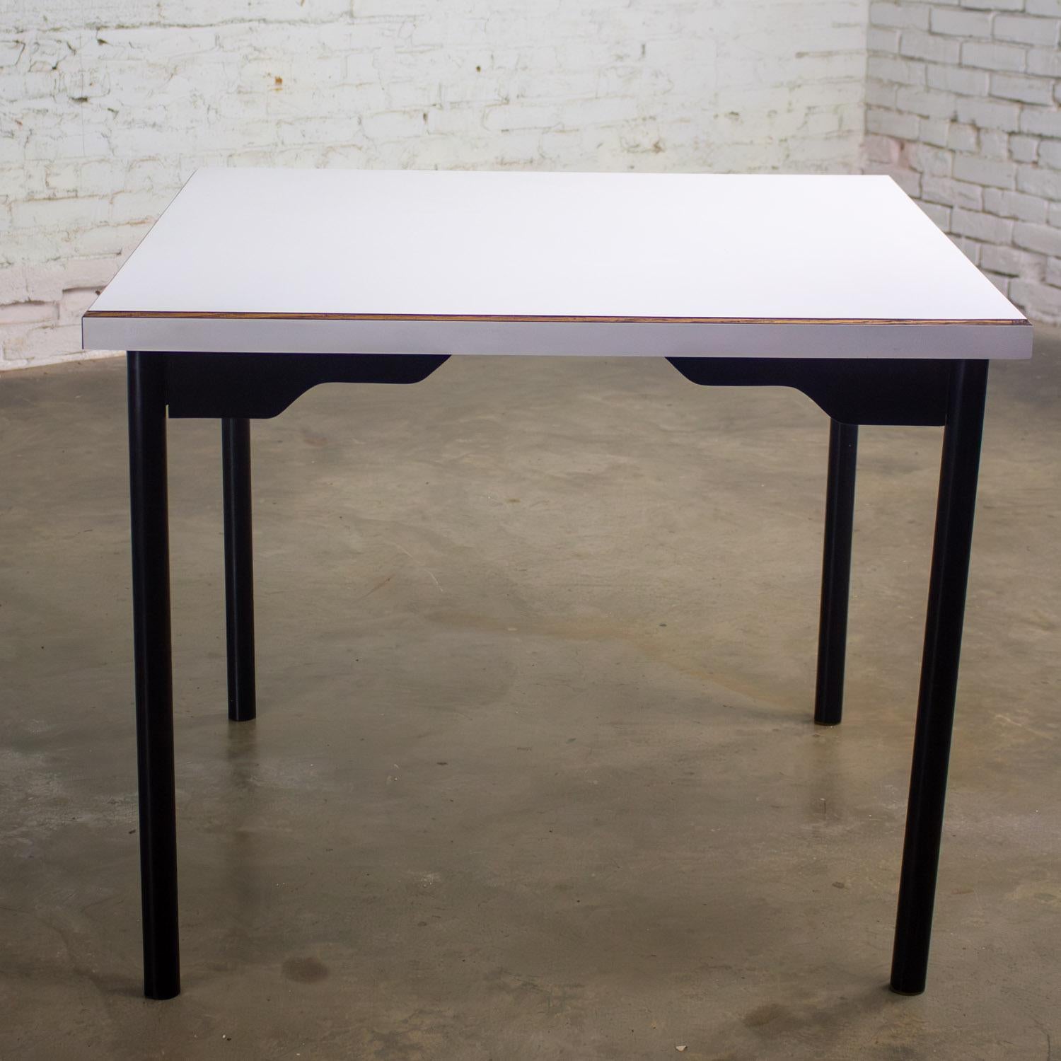Marvelous Mid to Late 20th Century MCM (a.k.a. Mid Century Modern) to Modern dining table with black painted steel tube frame & square white laminate top with a beveled plywood edge. Beautiful condition, keeping in mind that this is vintage and not