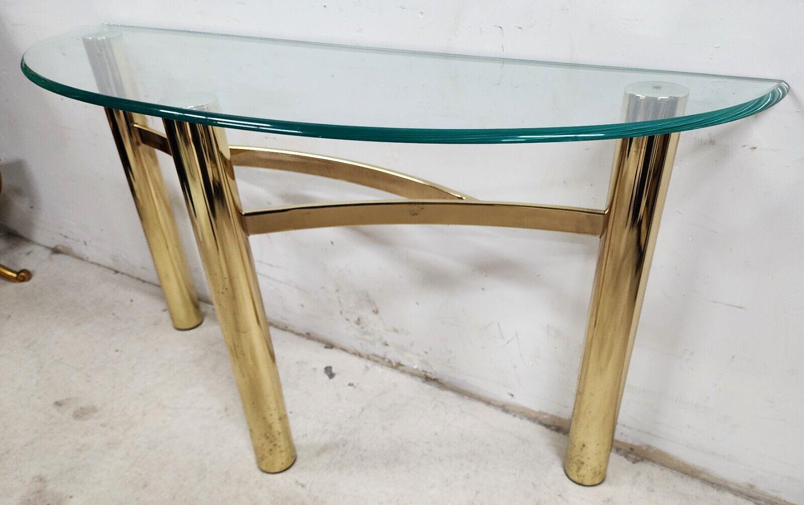 For FULL item description click on CONTINUE READING at the bottom of this page.

Offering One Of Our Recent Palm Beach Estate Fine Furniture Acquisitions Of A
MCM Tubular Brass Demilune Console Table Vintage

We also have 3 other matching side