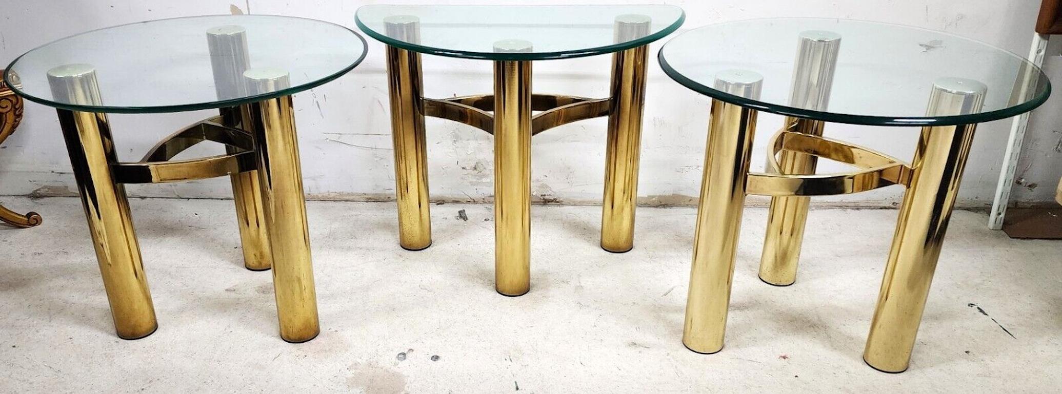 For FULL item description click on CONTINUE READING at the bottom of this page.

Offering One Of Our Recent Palm Beach Estate Fine Furniture Acquisitions Of A
3 Piece Set of MCM Tubular Brass Tables
Includes 2 round and 1 demilune (half moon)