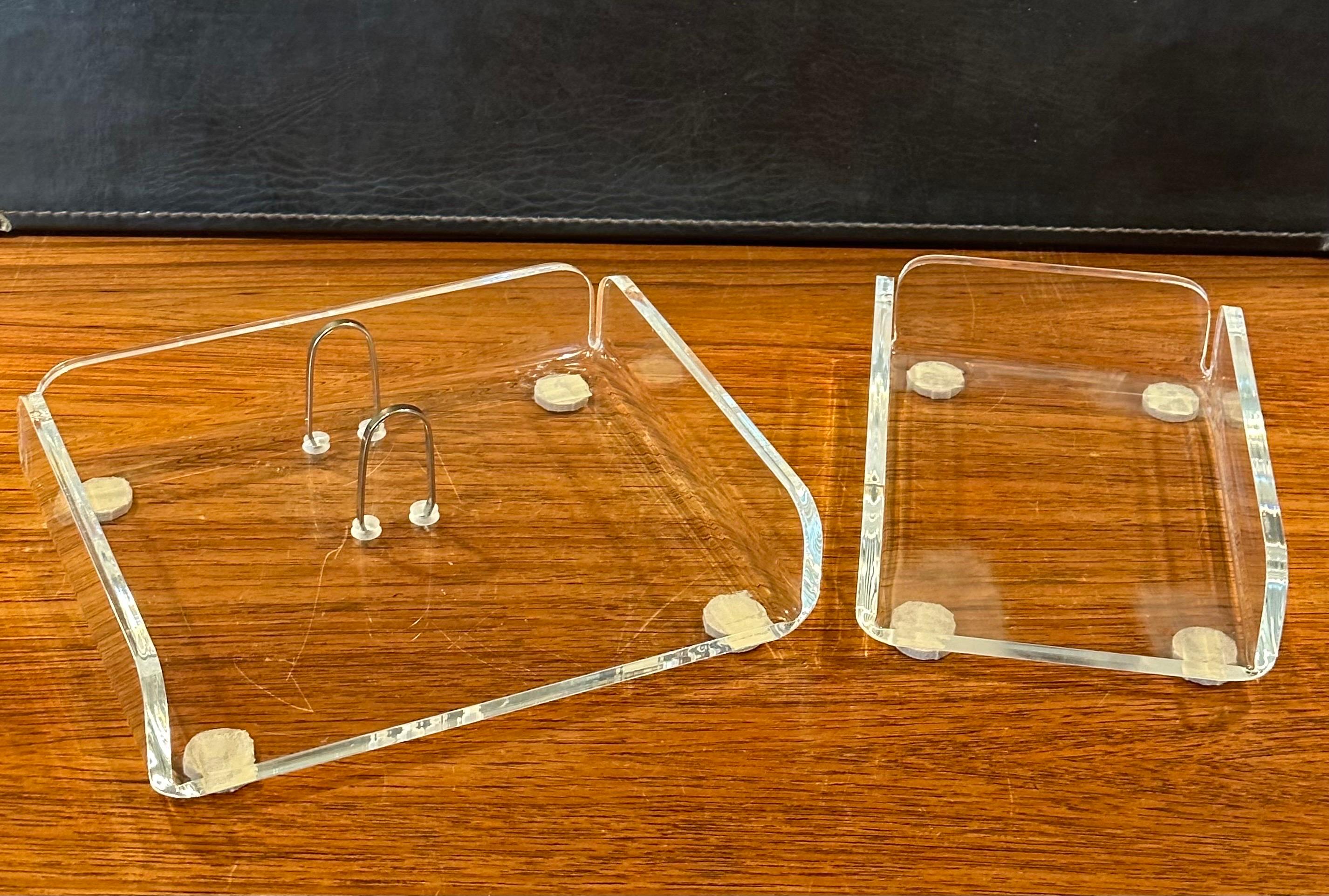 A very nice two piece lucite desk set, circa 1970s. The set is in good vintage condition and includes a loose leaf calendar holder and a scratch paper box.  The calendar measures 8.25