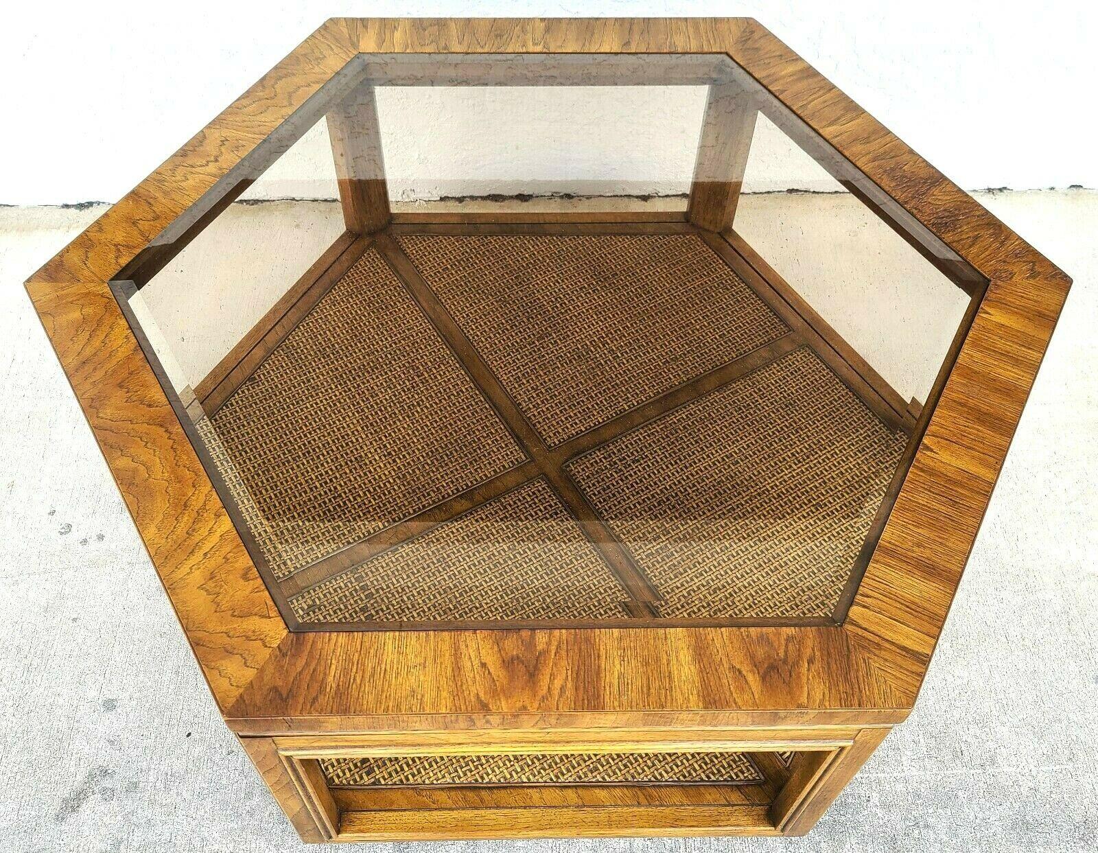 MCM Vintage Accolade Hexagonal glass Wicker coffee table by Drexel
Featuring a beveled glass top and wicker top on 1st tier.

Approximate measurements in inches
17