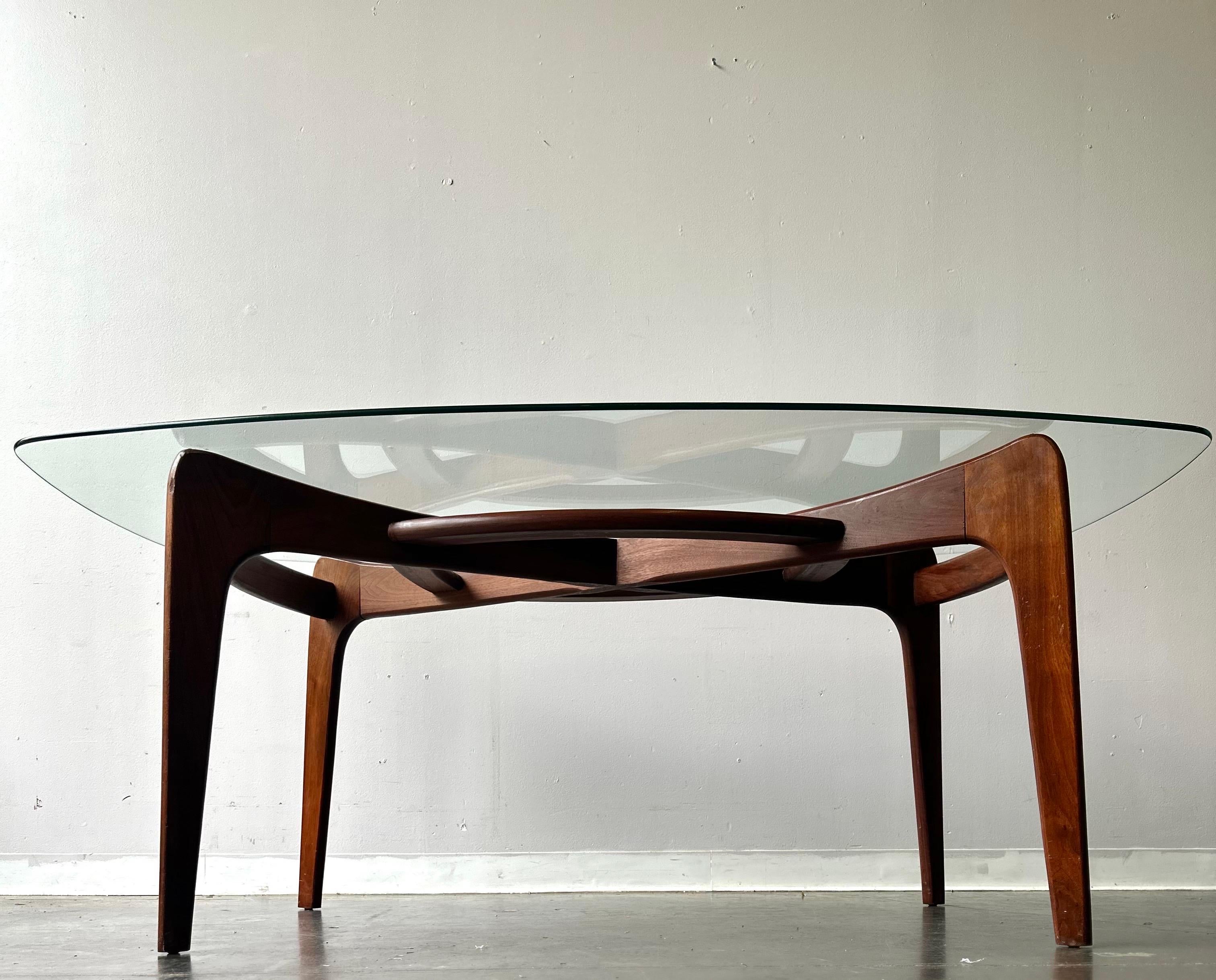 Adrian Pearsall Craft Associates dining table with walnut frame and glass top. Designed by Adrian Pearsall for Craft Associates. A masterful example of American 20th Century design. The table base stands as a work of art in and of itself. Pearsall