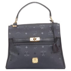 Sac à main MCM Vintage Kelly en nylon à motif Visetos, bordures en cuir et fermeture à tourlock, avec poignée sur le dessus