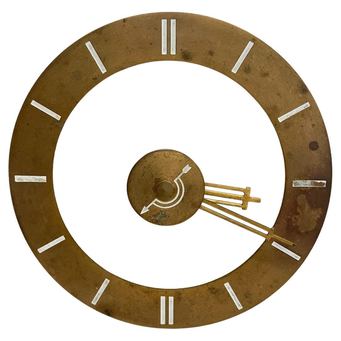 Fabulous Art Deco clock.
1930s Art Deco clock with quartzite marble stone and brass hands. 
By Hammond Clock Company Chicago IL
Retrofitted from electrical movement to quartz (battery operated) The back panel was preserved for looks, however, the