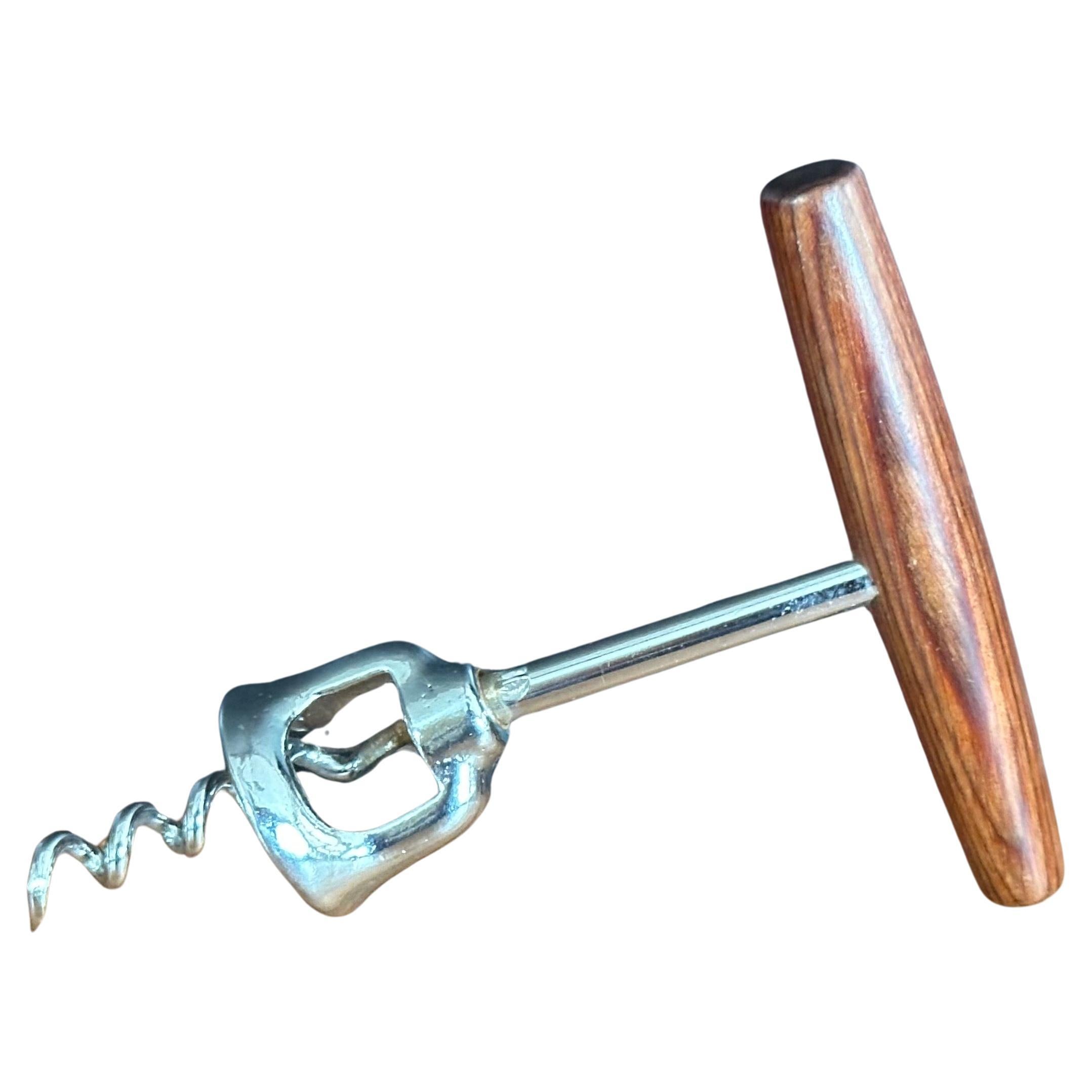 MCM walnut handled wine opener / corkscrew, circa 1970s. The piece is in very good condition and measures 3.75
