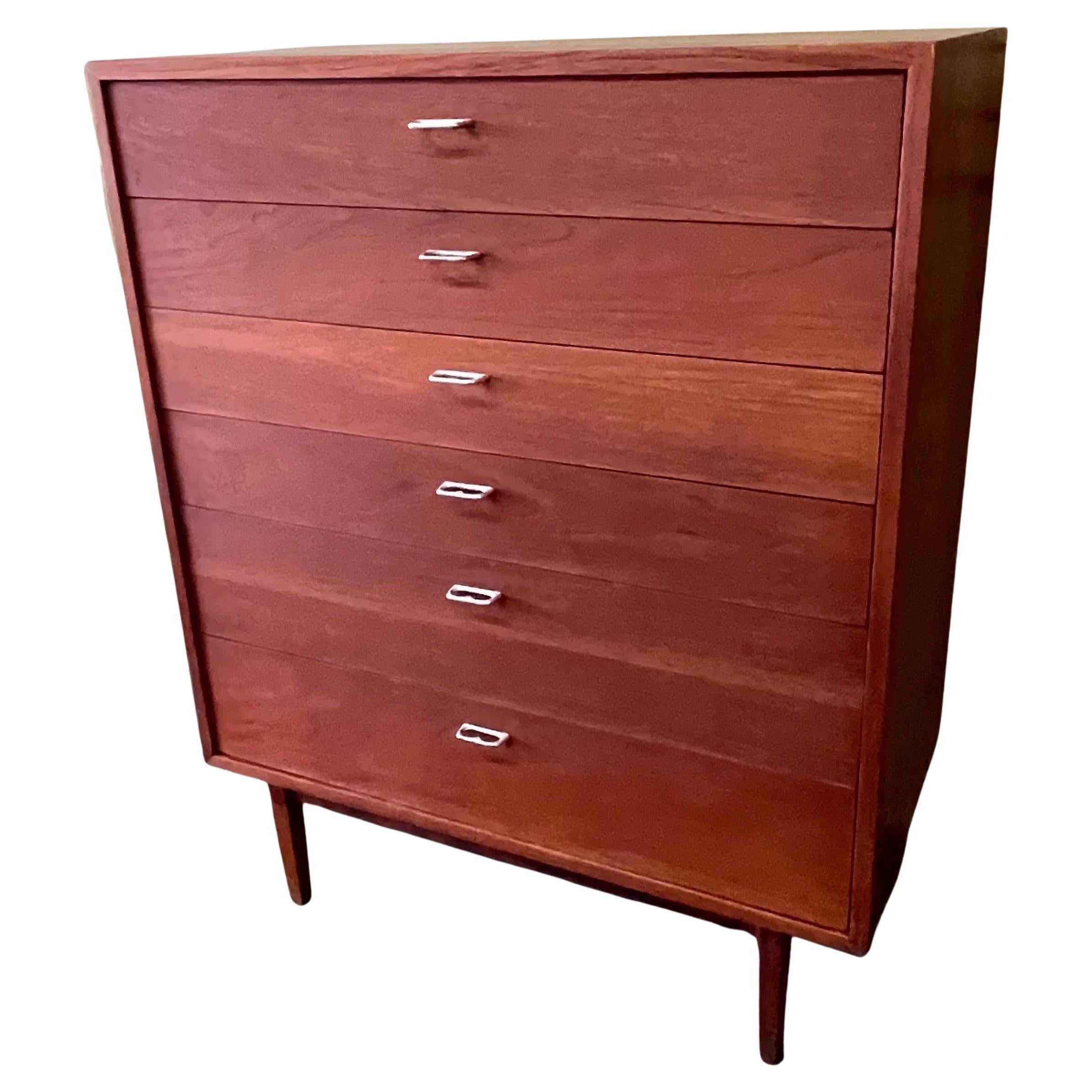Fabulous MCM walnut six drawer highboy dresser with aluminum two finger pulls in the style of George Nelson, circa 1960s. The piece has been professionally refinished and is in great restored condition with beautiful grained veneer, solid wood