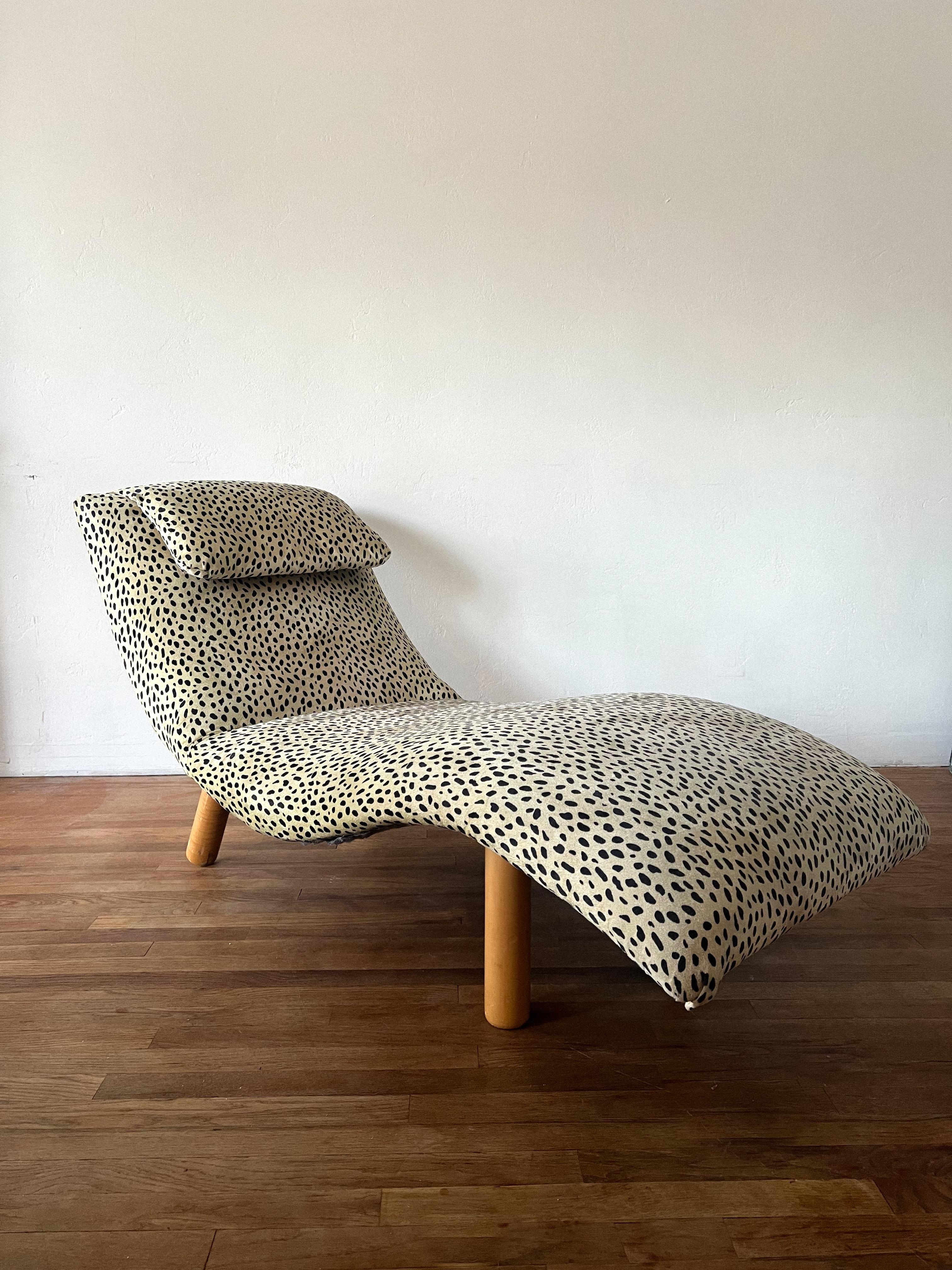 Sculptural chaise in the shape of a wave which has been attributed to designer Enrico Bartolini. Upholstered in a leopard print velvet. This is an amazing statement piece that is extremely comfortable.