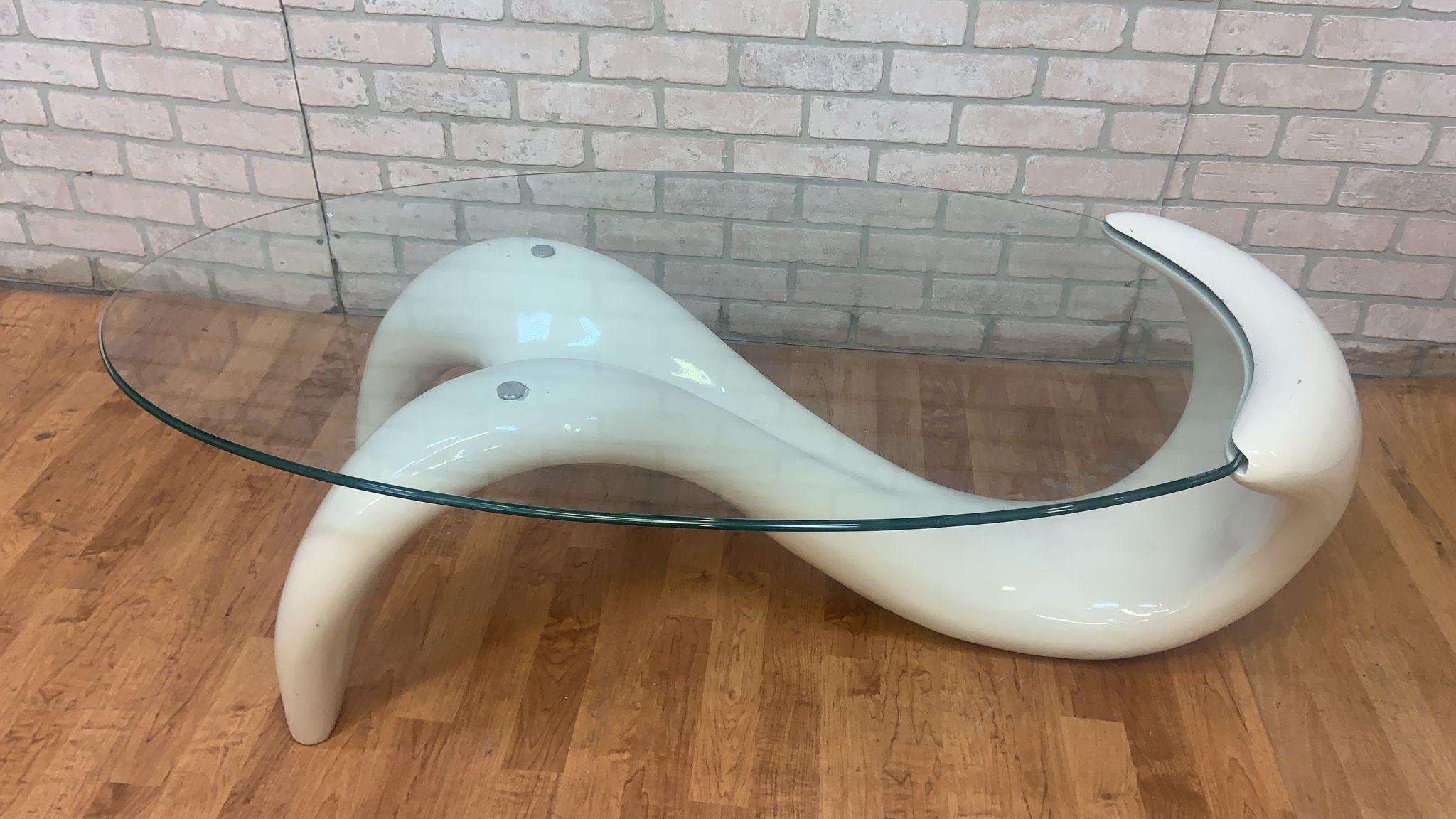 Mid Century Modern White Abstract Fiberglass Sculptural Base Oval Glass Top Coffee Table

This mid century modern abstract white table is going to be a speaking point in any room that it is featured in. The base is constructed of fiberglass and the