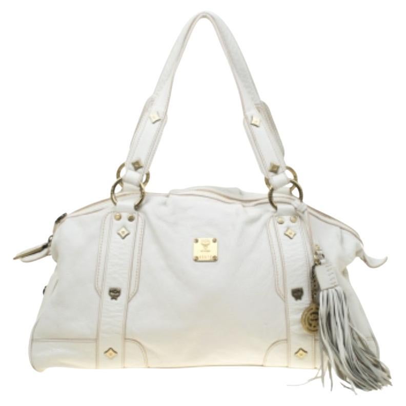 MCM Cartera con borla de piel blanca en venta