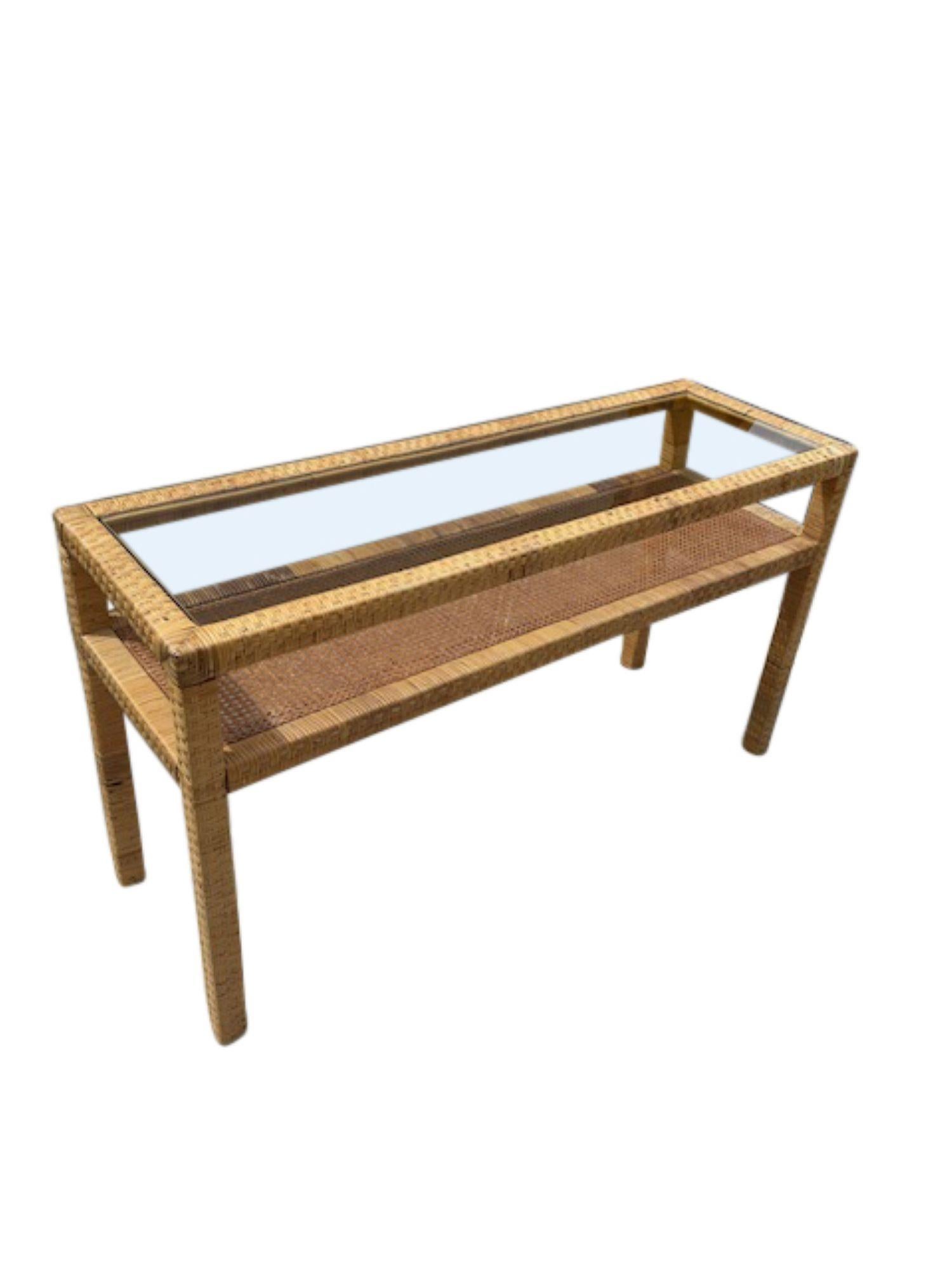 Rattan and Glass Two-Tier Console Table with Matching Wall Mirror
A beautifully handcrafted rattan and glass console table paired with a coordinating wall mirror. This elegant set captures the relaxed sophistication of tropical modernism, blending
