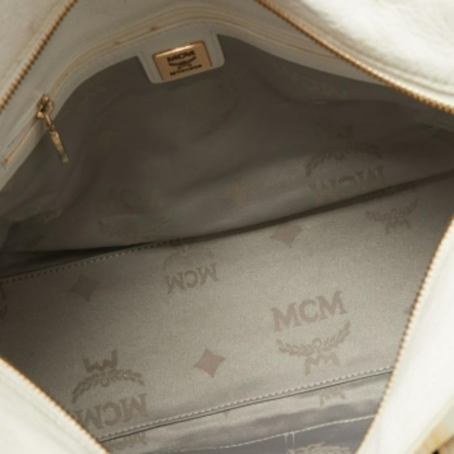 De las mujeres Bolso con cremallera MCM en piel estampada pitón amarillo/negro en venta