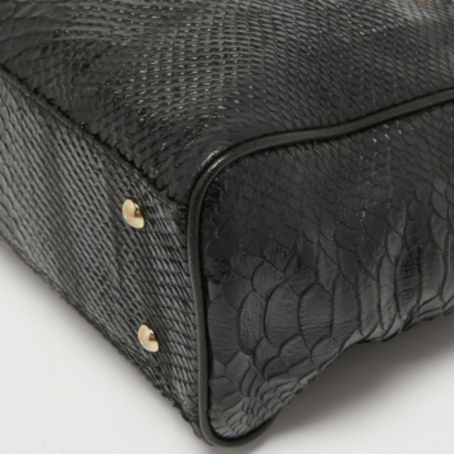 Bolso con cremallera MCM en piel estampada pitón amarillo/negro en venta 1