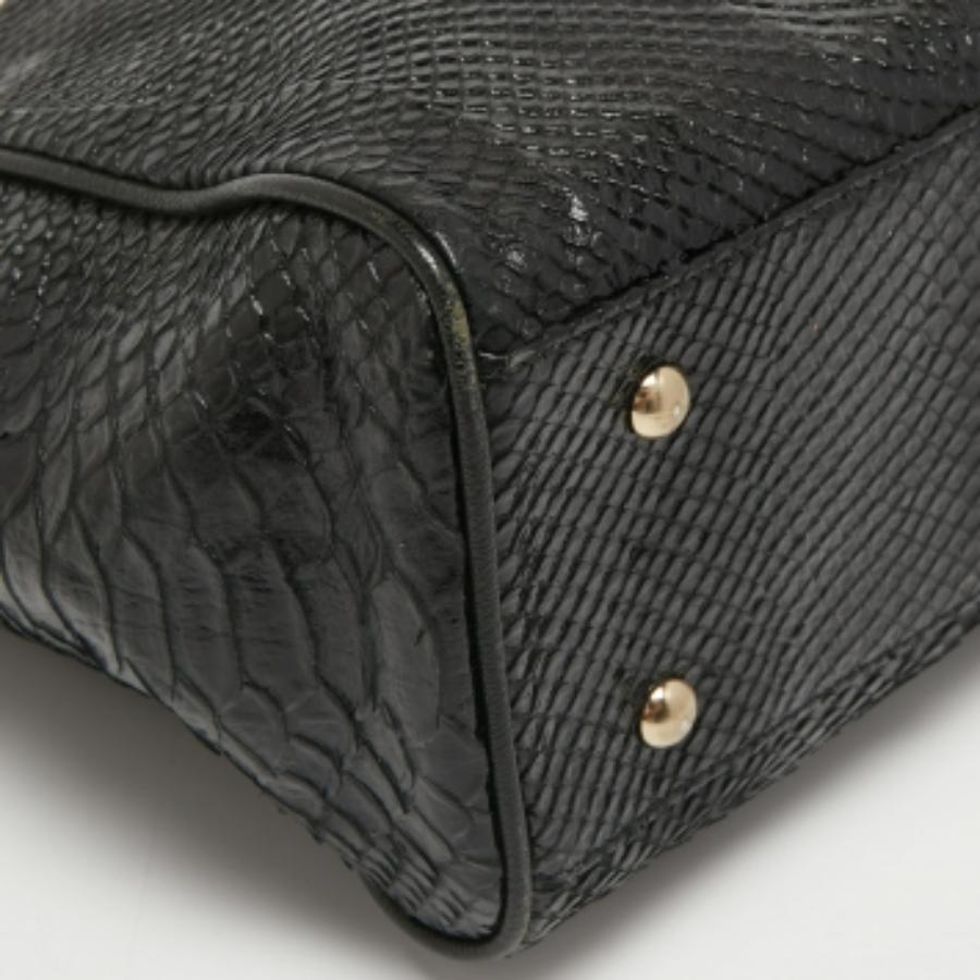 Bolso con cremallera MCM en piel estampada pitón amarillo/negro en venta 2