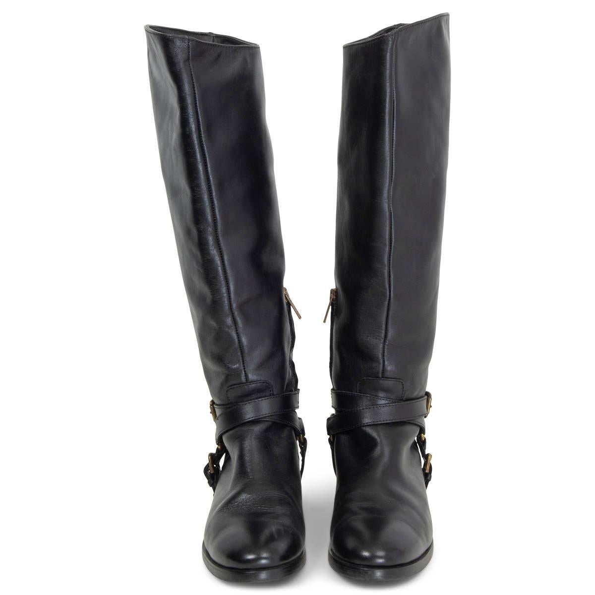 100% authentic McQ Alexander McQueen rinding boots in black smooth calfskin with belted chain embellishment in antique gold-tone metal. Have been worn and are in excellent condition. Come with dust bag. 

Measurements
Imprinted Size	39
Shoe