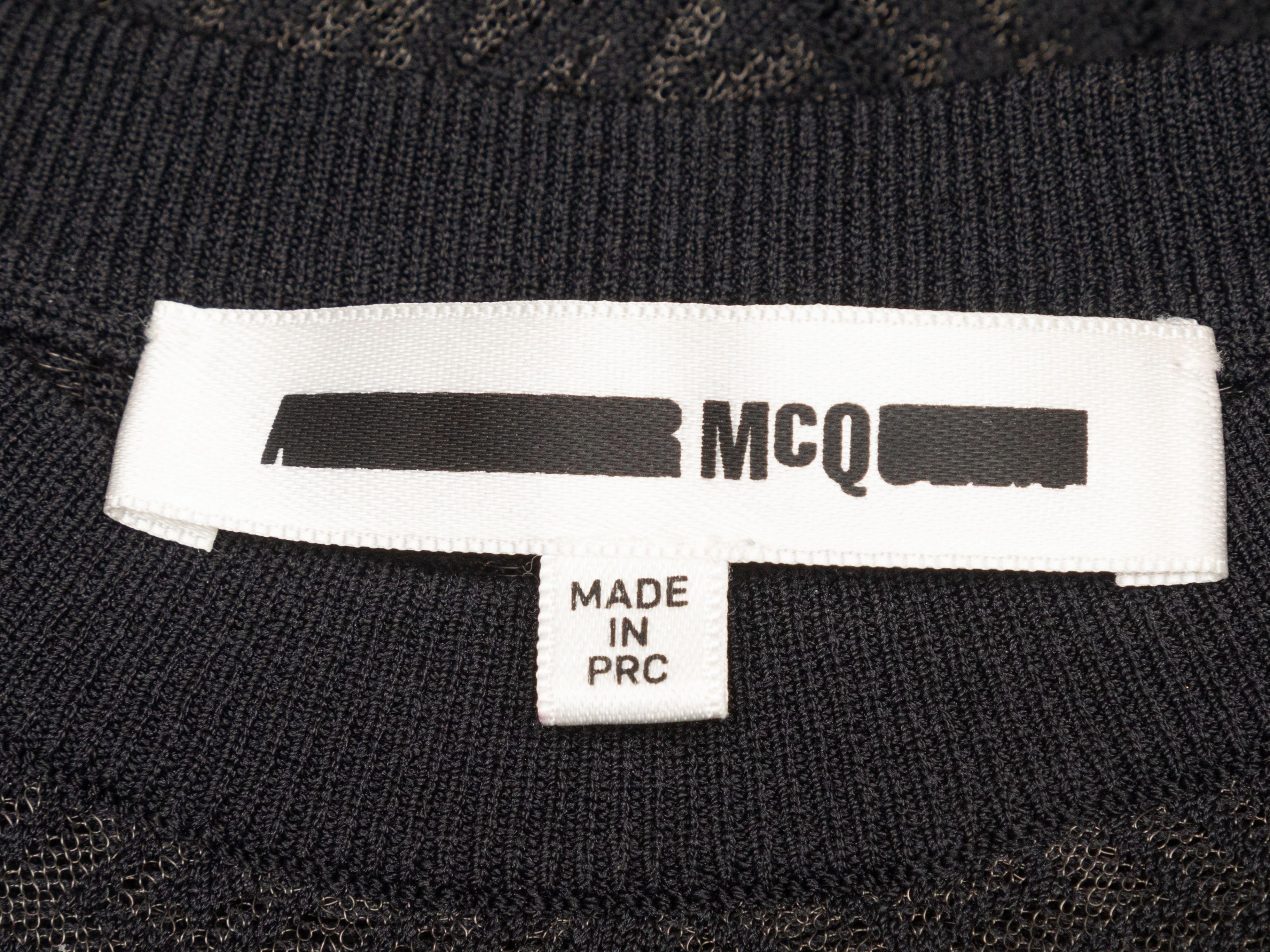 Product Details: Black open knit long sleeve mini dress by McQ Alexander McQueen. Opaque slip at interior. Crew neck. 26