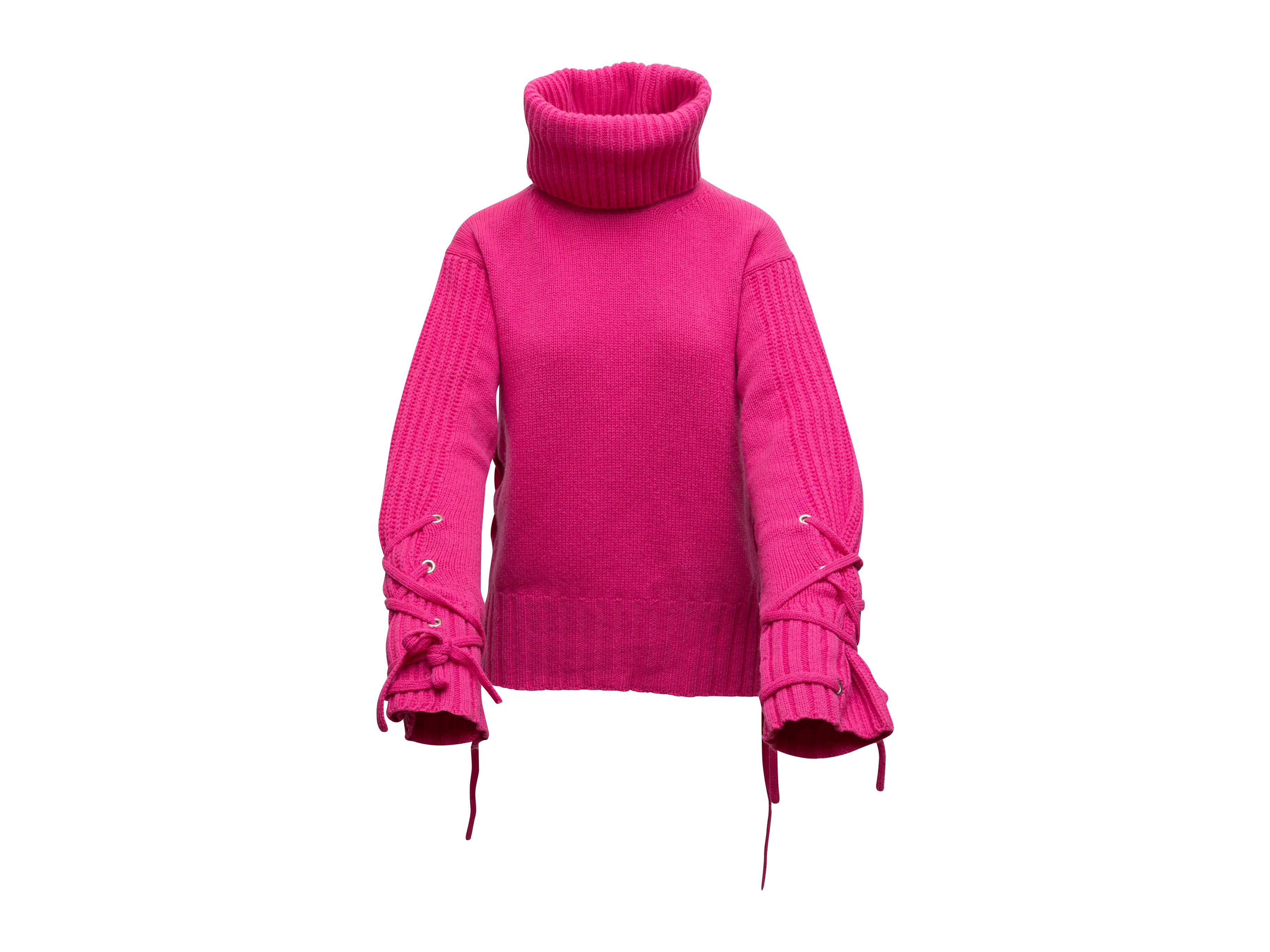 bright pink turtleneck sweater