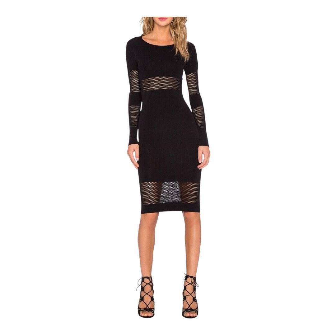 McQ Alexander McQueen Sheer Panel Body-Con Midi Dress
United Kingdom, 2010s

Sleek and striking, this McQ Alexander McQueen midi dress exemplifies the brand’s signature blend of edge and elegance. Crafted in a rich stretch knit, the body-conscious