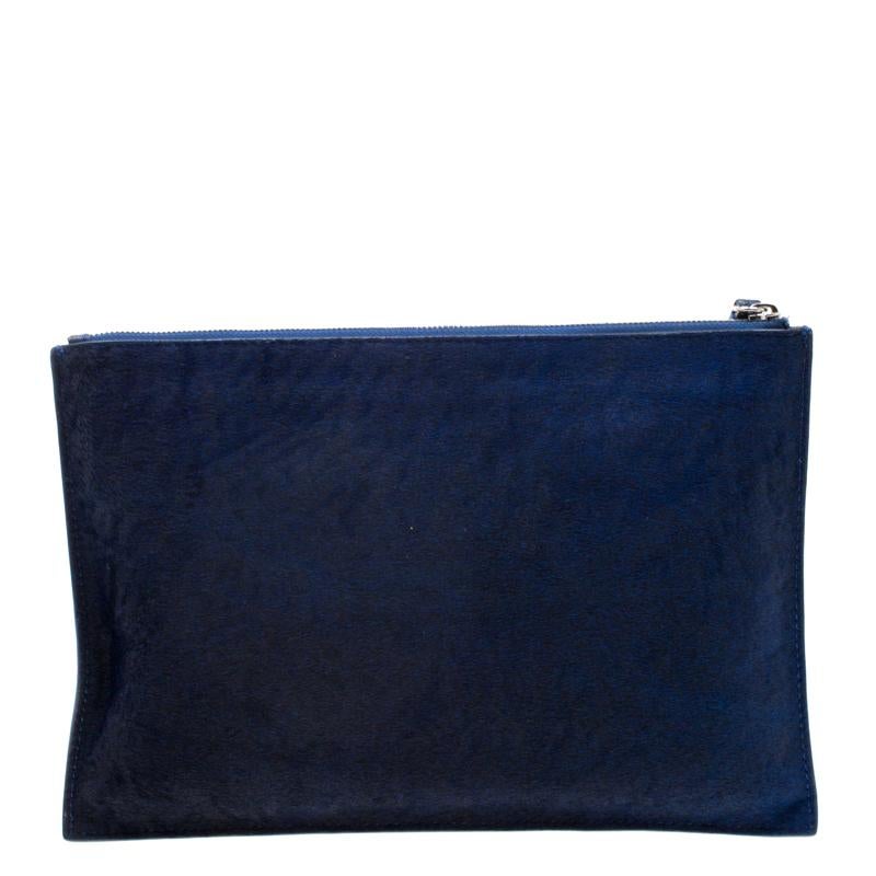 Crafted from calfhair and styled with a gorgeous blue hue, this Bullet Kicks clutch from MCQ by Alexander McQueen is that handy accessory that you'll love to carry always. It features a top zipper closure that leads to a fabric-lined interior.