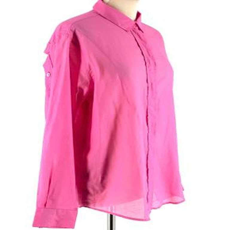 Alexander McQueen Fushsia Pink Shirt IT 44

- Fushsia pink coloured shirt
- Light weight sheer cotton
- Soft silk-like material
- Pink pearly buttons
- Relaxed fit
- Back button detailing across shoulders
- Buttoned cuffs

Made in Romania

Fabric