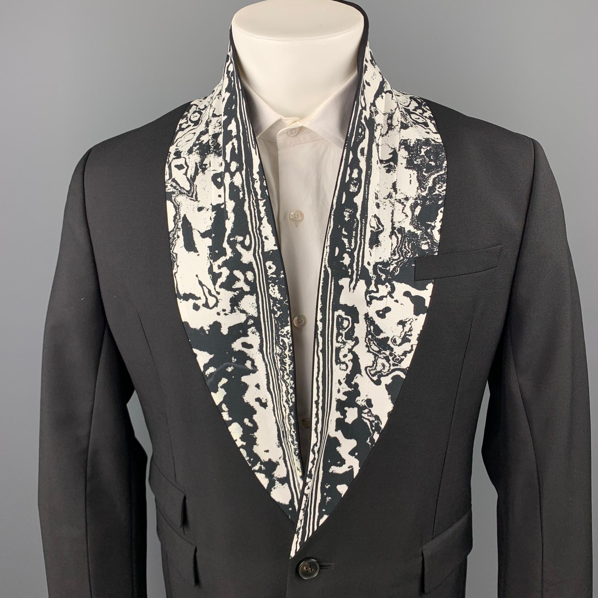 MCQ by ALEXANDER McQUEEN sport coat comes in a black wool / mohair with a full monogram print featuring a printed shawl collar, flap pockets, and a single button closure. Made in Portugal.

Excellent Pre-Owned Condition.
Marked: IT