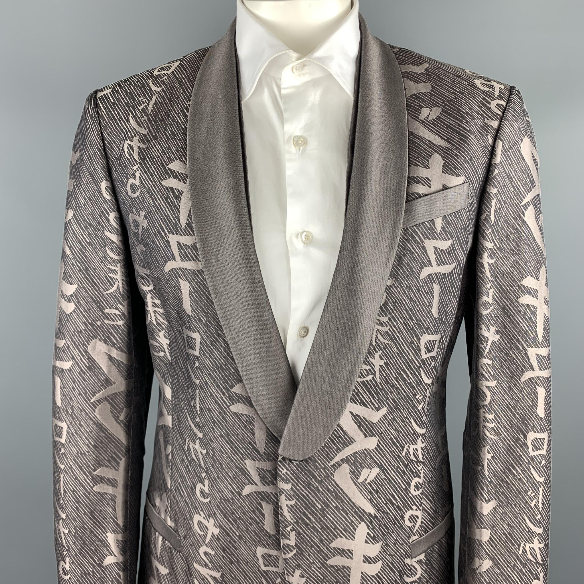 MCQ by ALEXANDER MCQUEEN sport coat comes in a taupe print cotton / silk featuring a shawl collar, slit pockets, and a single button closure. Made in Italy.

Excellent Pre-Owned Condition.
Marked: IT 54

Measurements:

Shoulder: 18 in. 
Chest: 42
