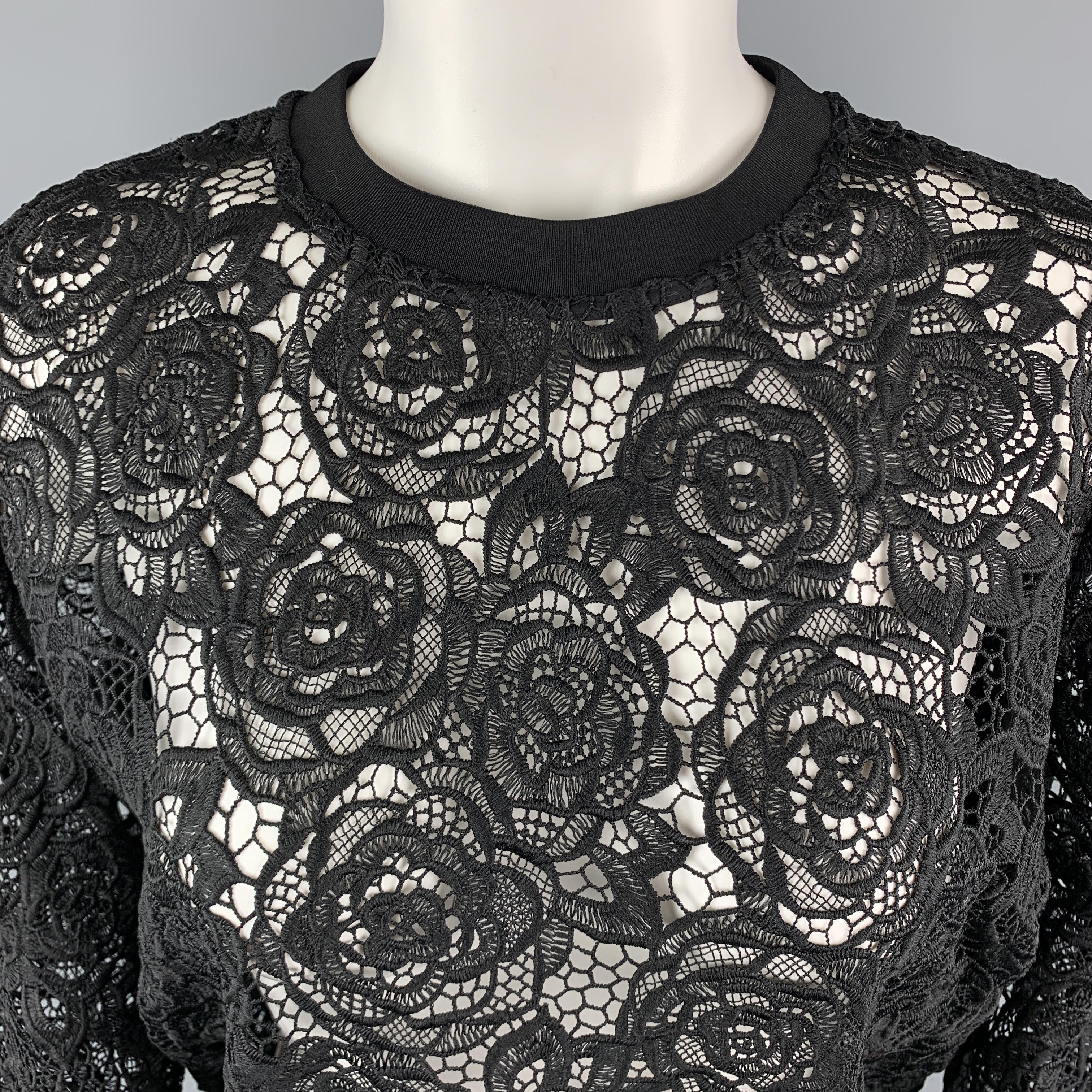 MCQ by ALEXANDER MCQUEEN Pullover Sweater comes in a black tone in a floral motif lace material, with a crewneck, a back zip, and ribbed cuffs and hem. 

Excellent Pre-Owned Condition.
Marked: IT 38

Measurements:

Shoulder: 15 in. 
Bust: 41 in.