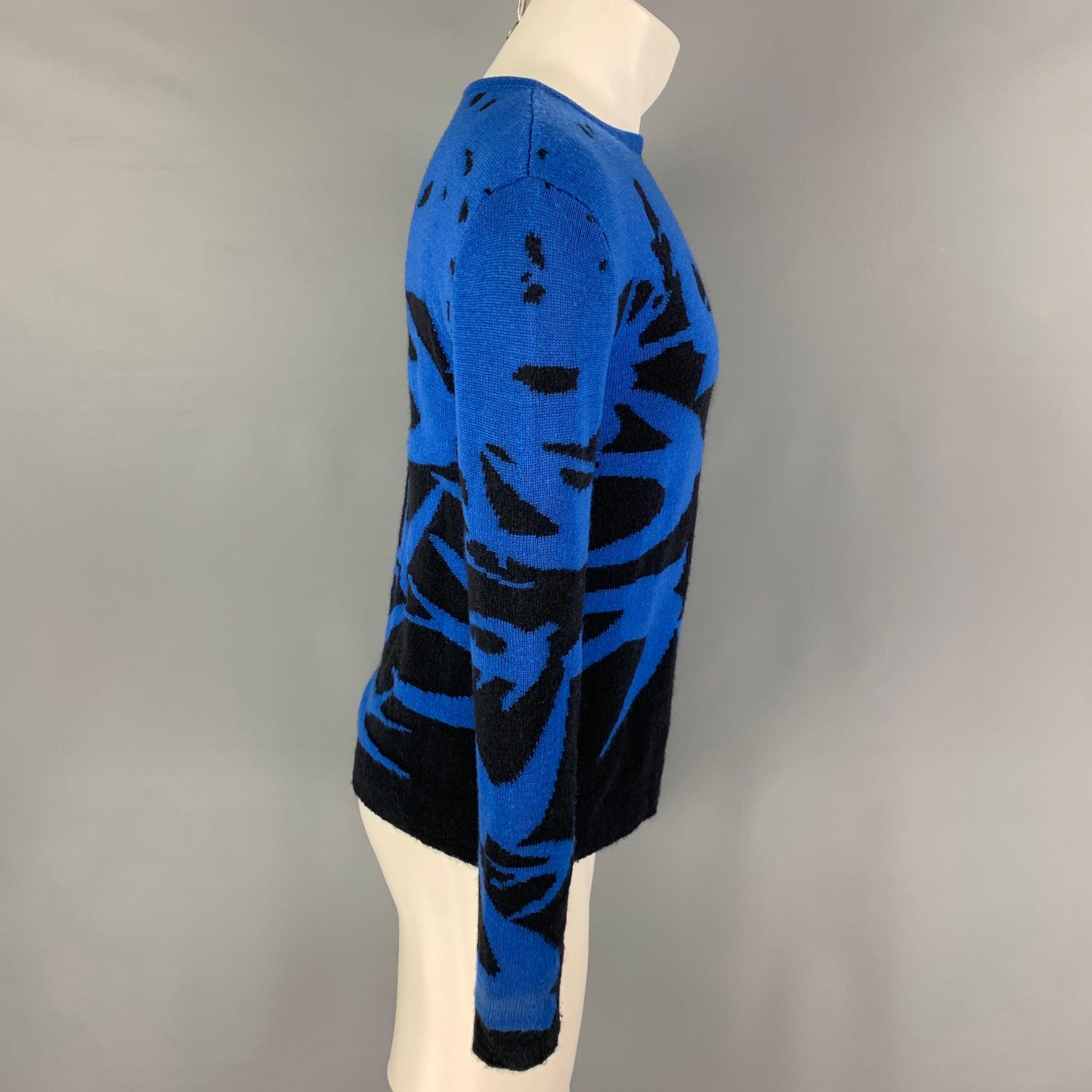 MCQ by ALEXANDER McQUEEN pullover comes in a blue & black print wool blend featuring a crew-nec. 

Good Pre-Owned Condition. Light discoloration. As-is.
Marked: XS

Measurements:

Shoulder: 20 in.
Chest: 38 in.
Sleeve: 27 in.
Length: 24 in.