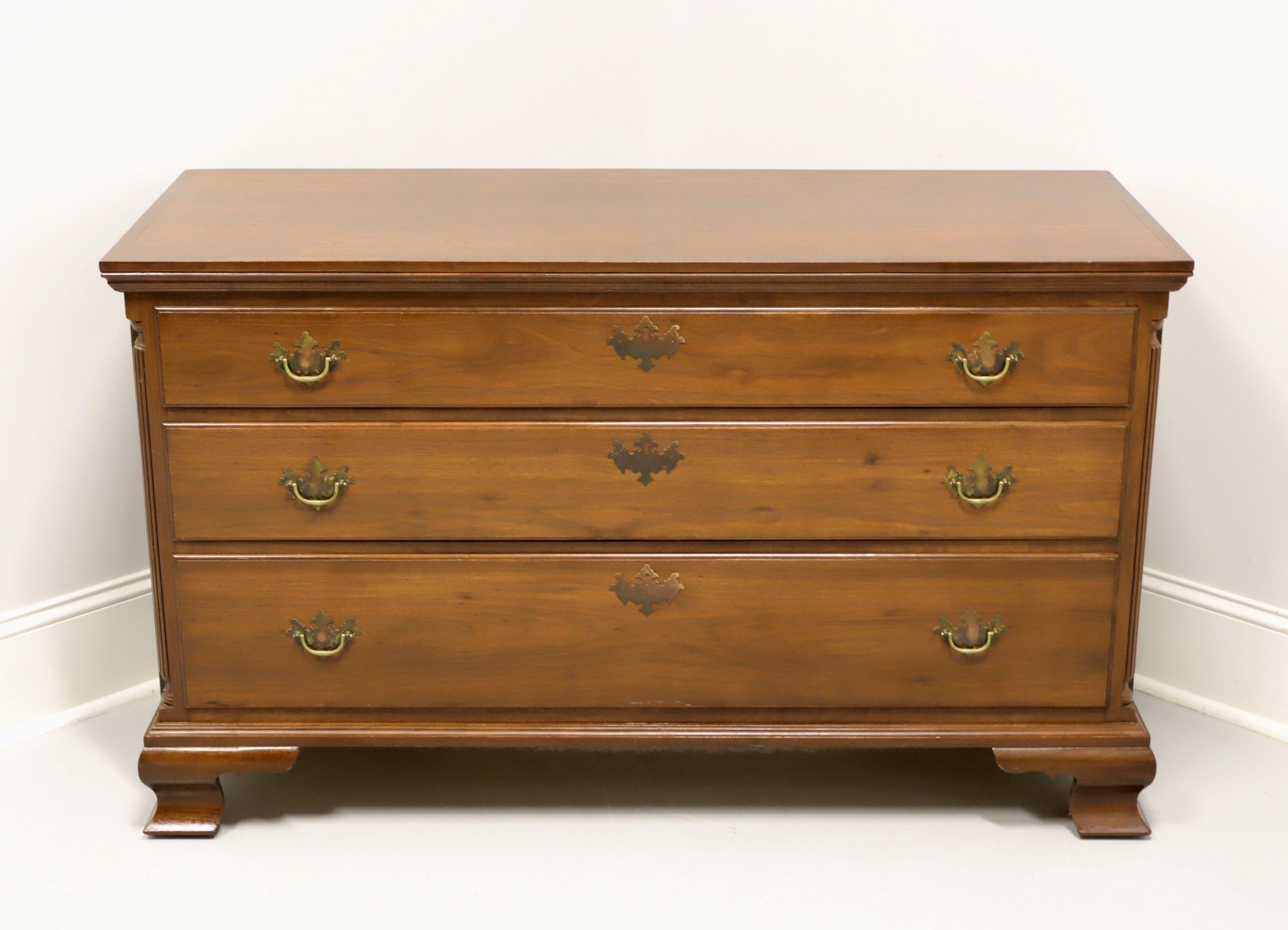 A Chippendale style single dresser by McSwain's Handcrafted Furniture, a custom furniture maker located in Charlotte, North Carolina, USA. Solid walnut with brass hardware, fluted columns to sides and ogee bracket feet. Features three drawers of