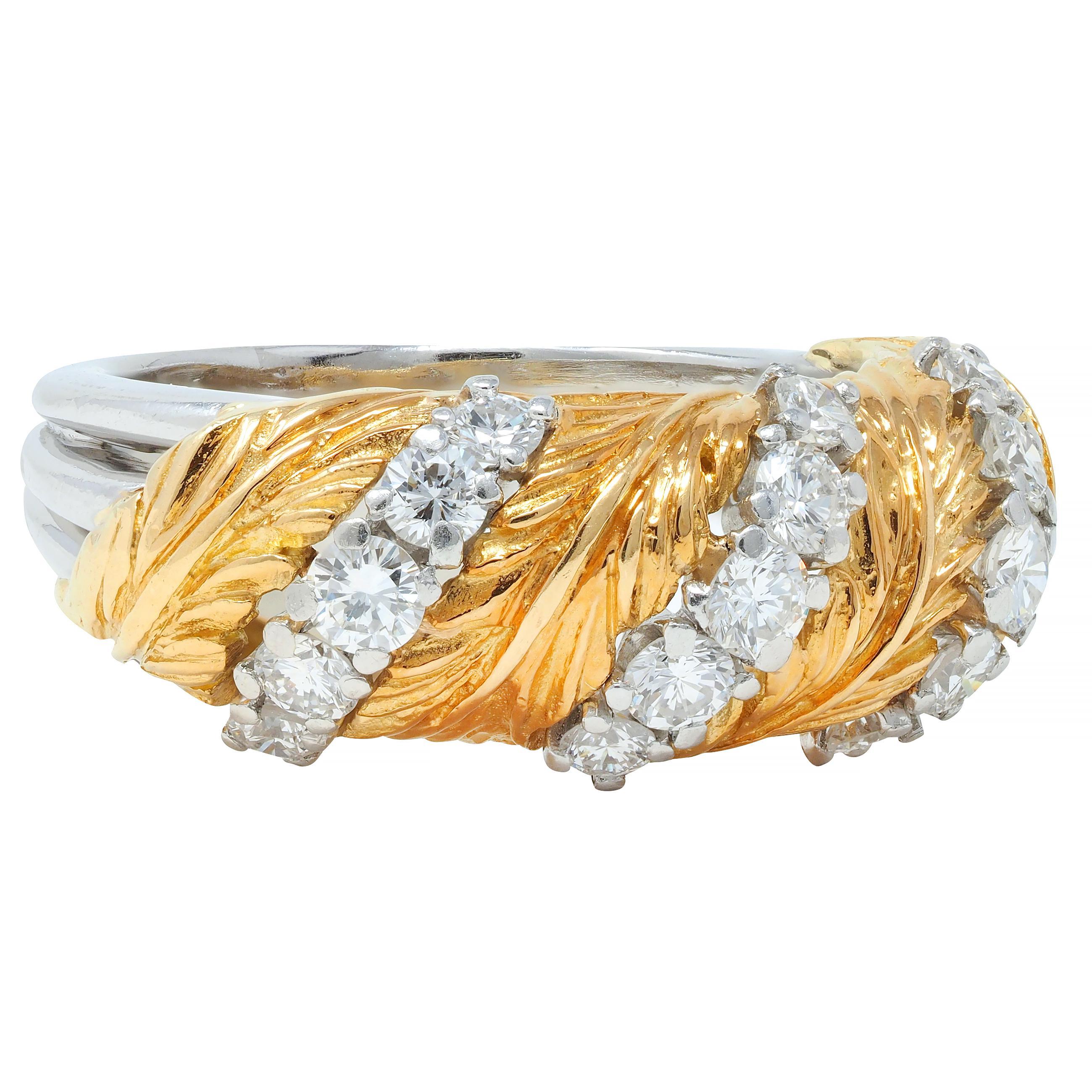 Designed as a wide band with highly rendered twisting feather motif
Gold with engraved texture detailing throughout 
Alternating in twist pattern with rows of diamonds
Prong set in platinum and round brilliant cut 
Weighing approximately 0.66 carat