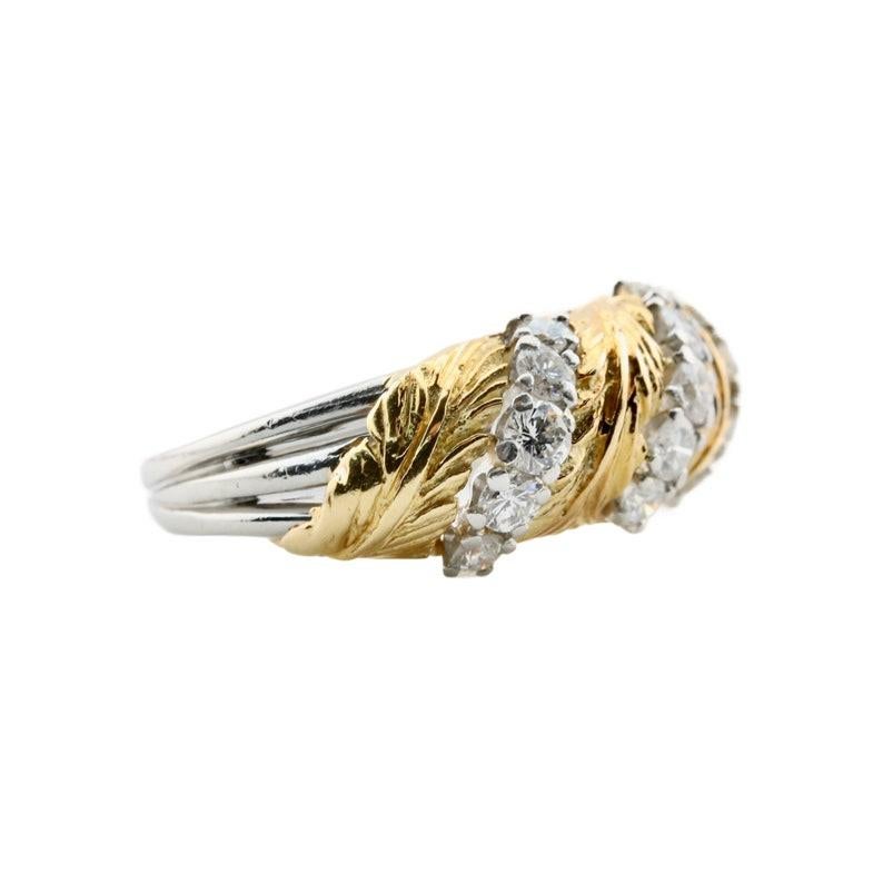 Aston Estate Jewelry Presents:

A vintage leaf motif diamond band ring by McTeigue & McClelland. Featuring a quartet of richly carved yellow gold leaves accented by fifteen brilliant cut diamonds set into platinum. Of 0.60ctw, the diamonds grade as