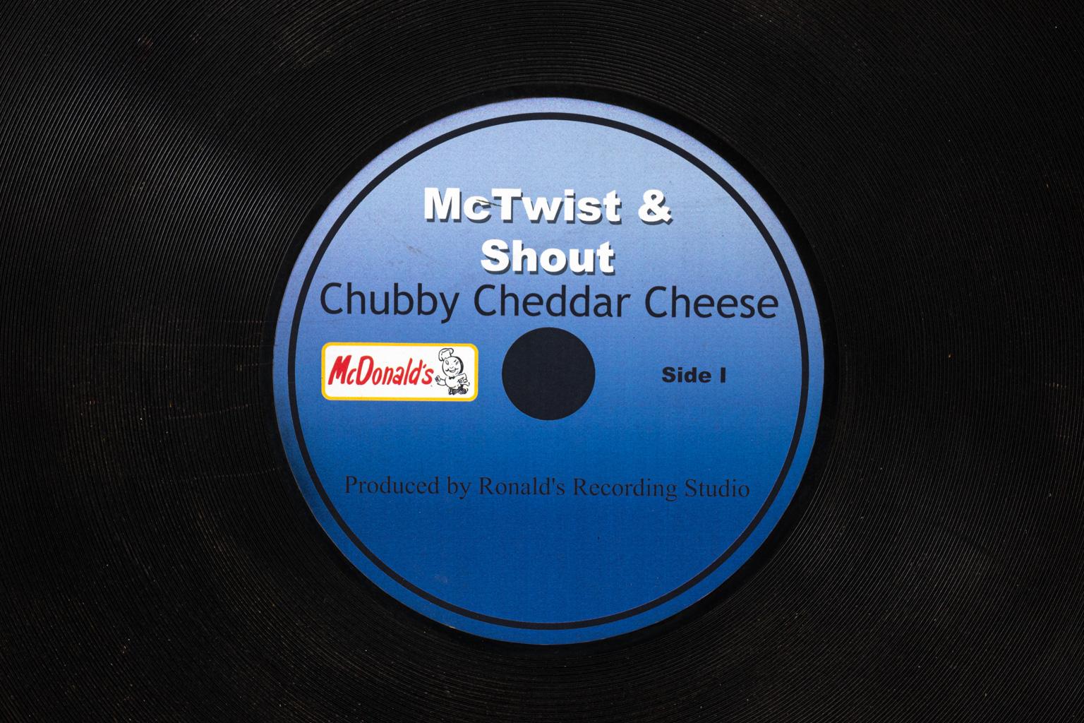 McTwist and shout chubby cheddar cheese advertising record made of wood and paper, circa 1960s. 
